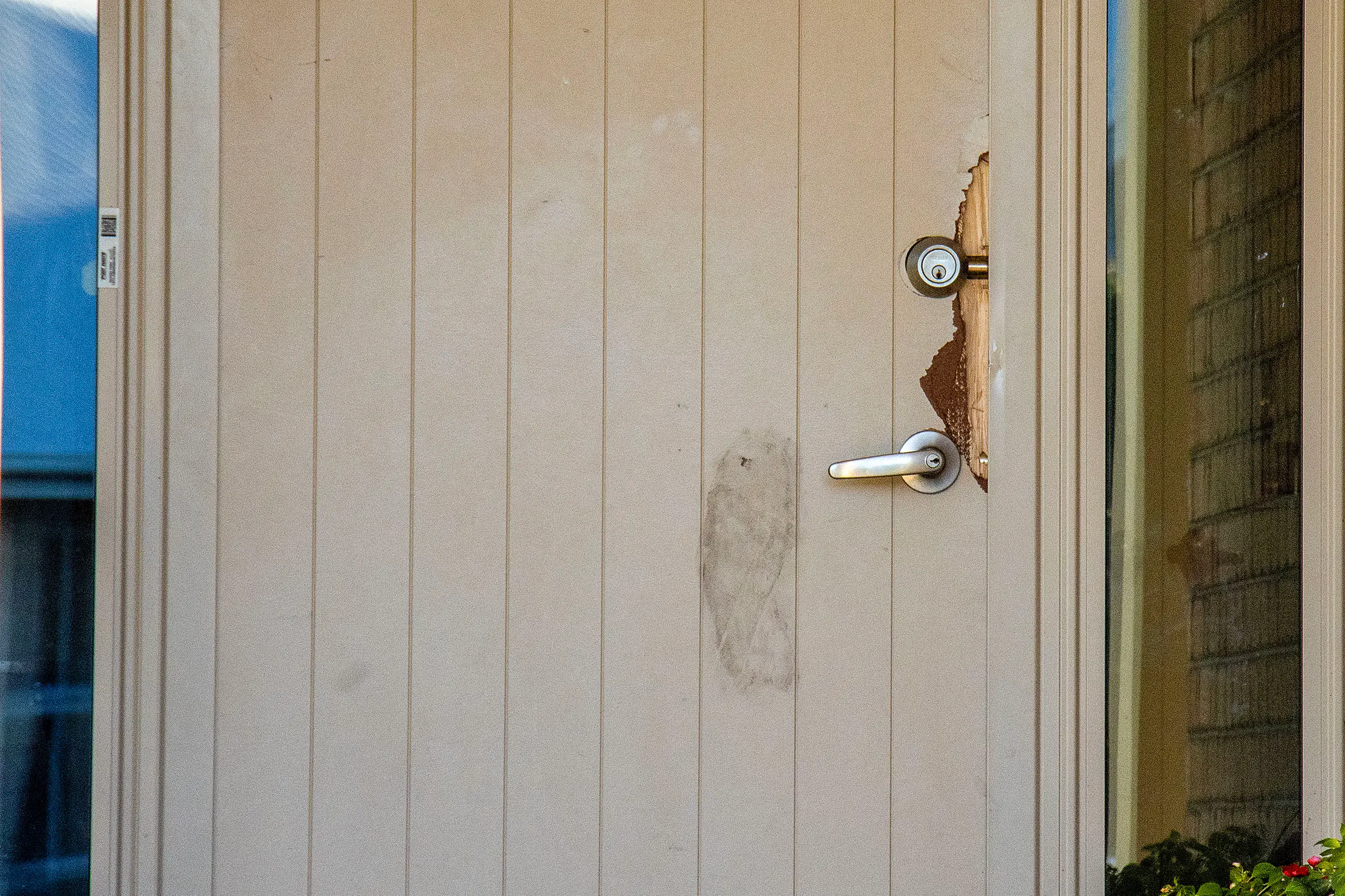 The front door of a house on Jacobsens Place which was jemmyed open during an aggravated burglary. Photo: Geoff Sloan