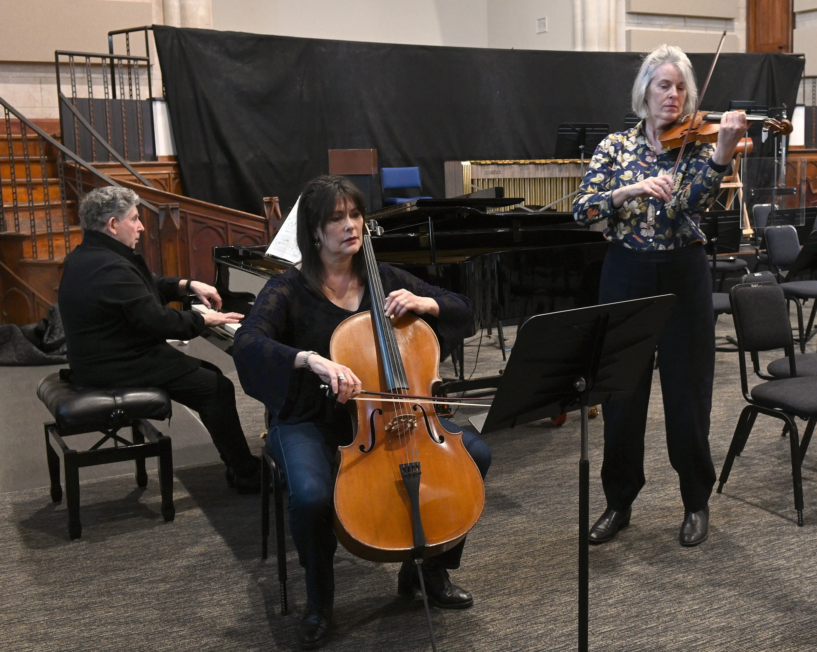 Prof Terence Dennis (piano) Dr Heleen du Plessis (cello), and Tessa Petersen, (violin) rehearse at Hanover Hall. Photo: Linda Robertson