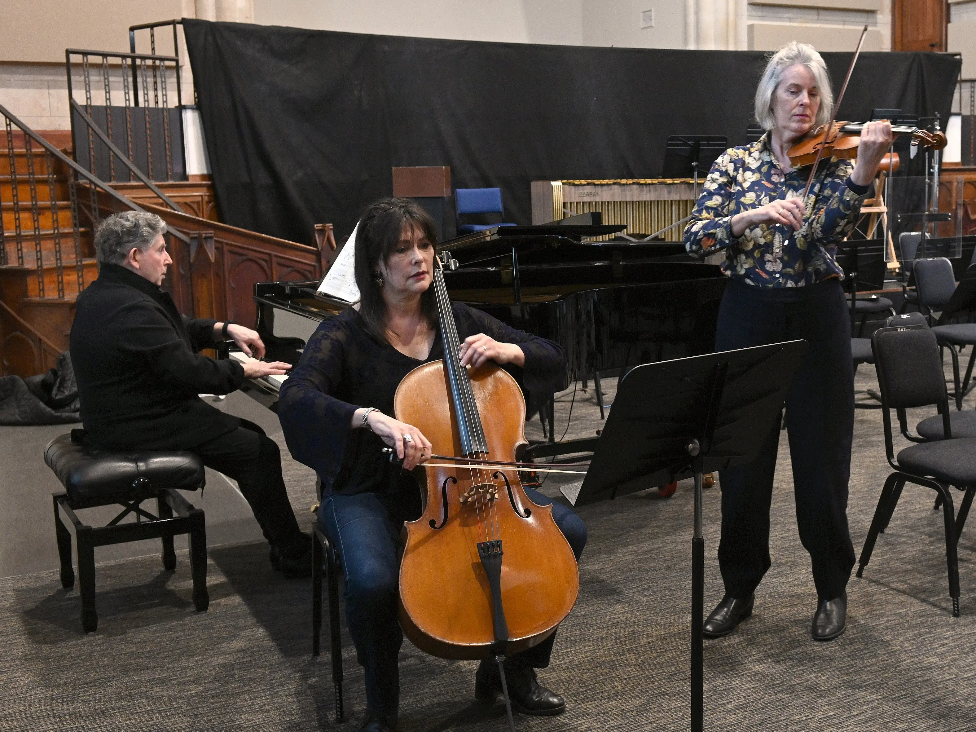Prof Terence Dennis (piano) Dr Heleen du Plessis (cello), and Tessa Petersen, (violin)  rehearse at Hanover Hall. Photo: Linda Robertson
