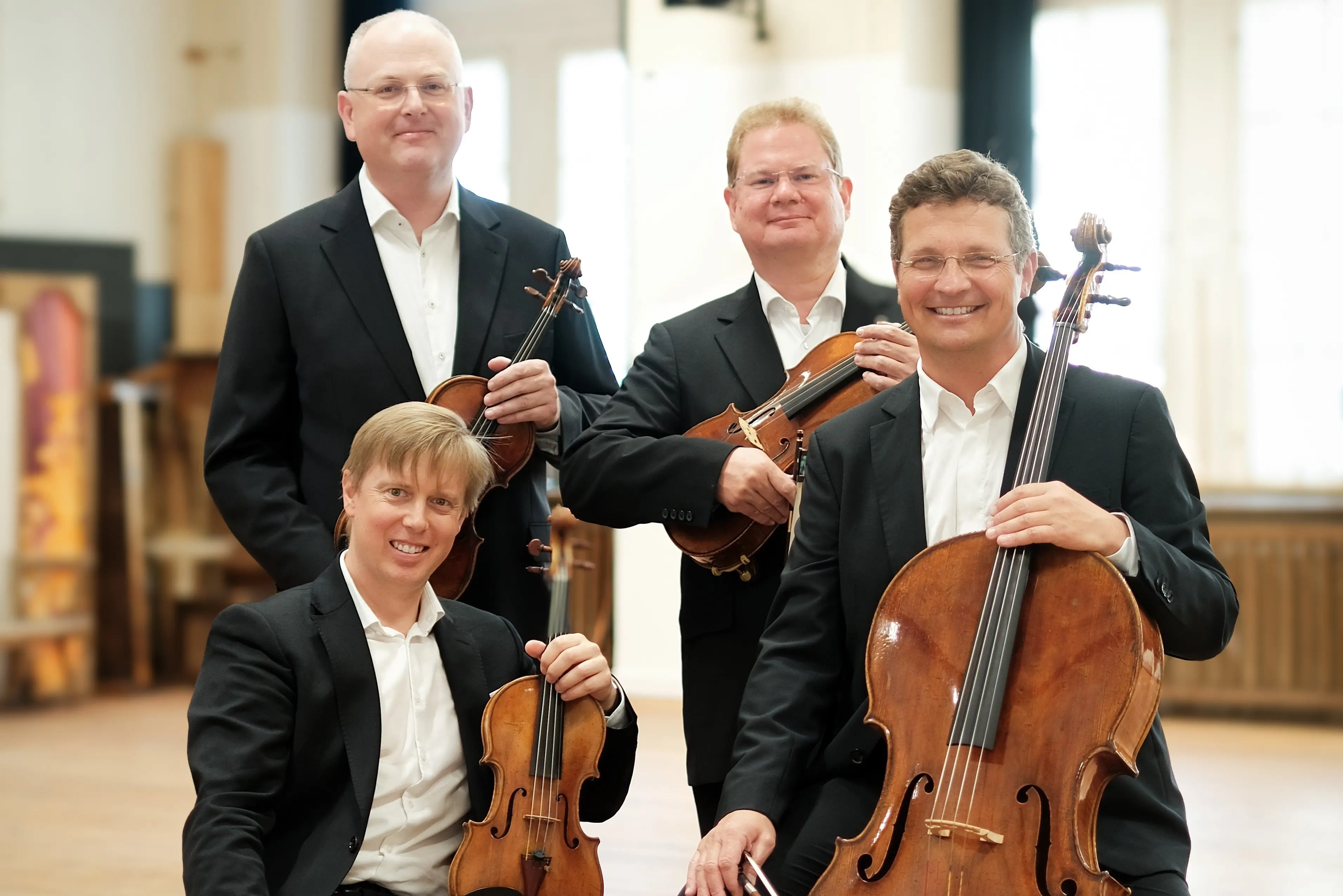 The Phileo Quartet, featuring Vienna Philharmonic orchestra musicians (standing, from left) Holger Groh, Robert Bauerstatter (viola), (front) Benjamin Morrison (violin) and Wolfgang Hartel (cello), are on tour with Chamber Music NZ and will perform in Dunedin on July 22. Photo: Supplied