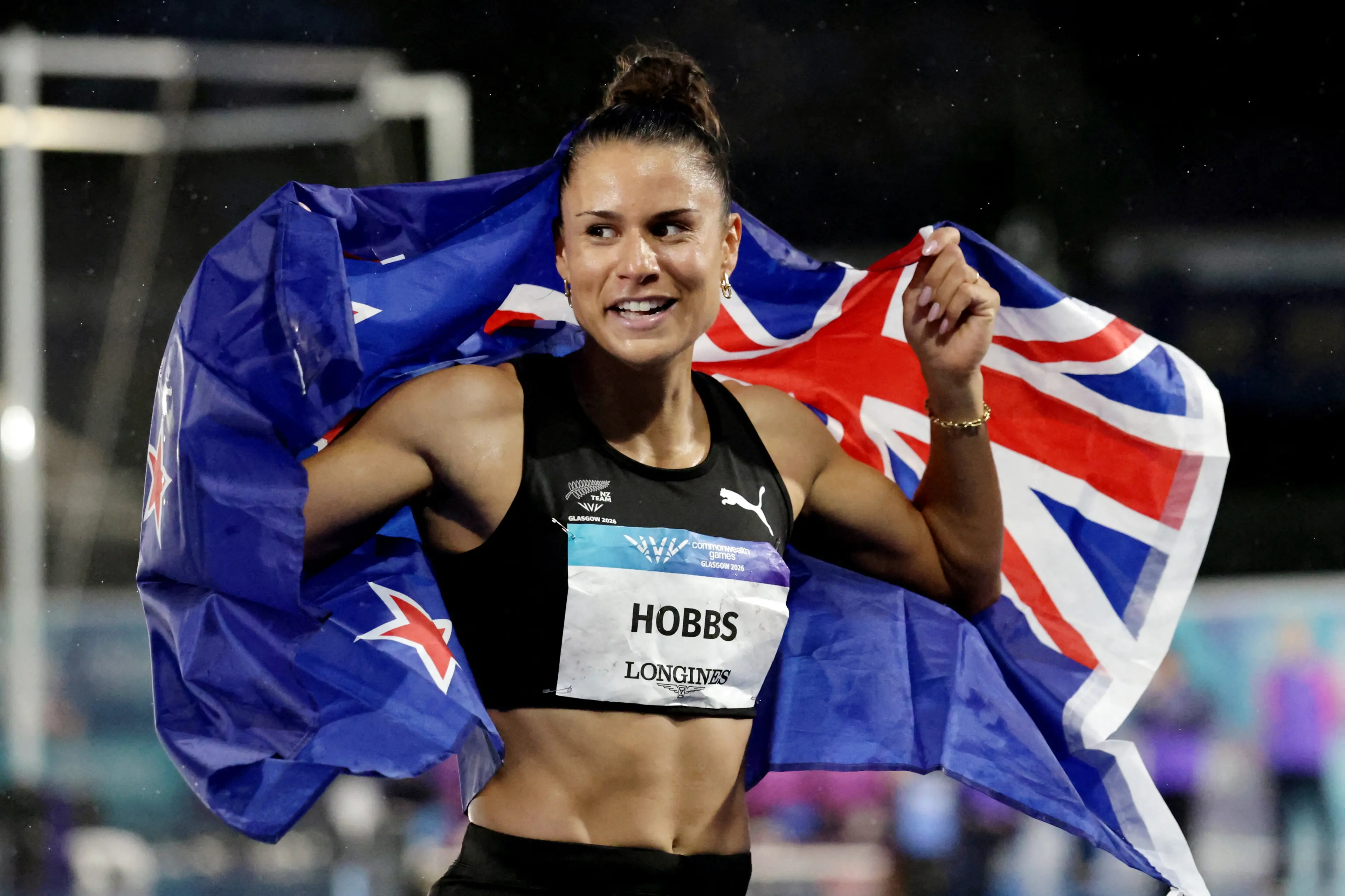 New Zealand sprinter Zoe Hobbs celebrates after winning the women\\'s 100m final at the Commonwealth Games in Glasgow. Photo: Reuters