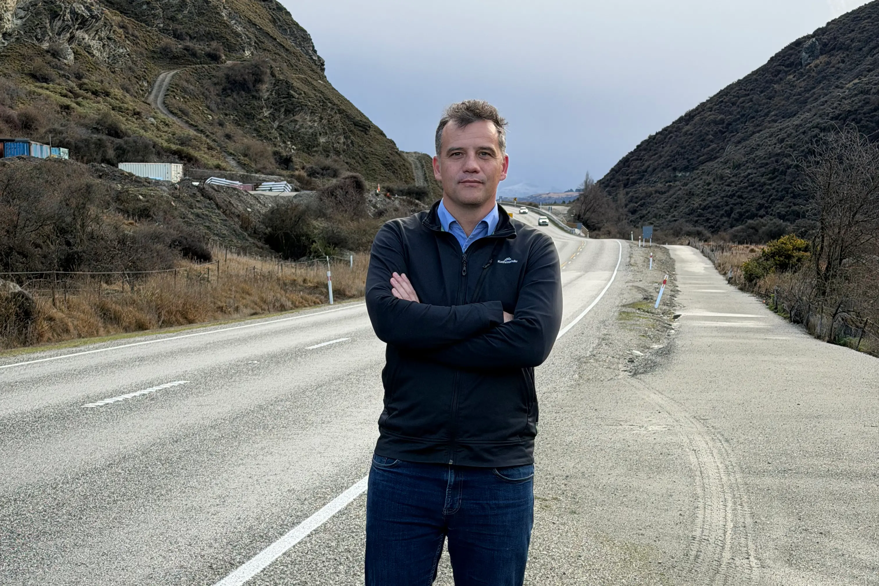 \\u2018Cheaper option available\\u2019: National MP Joseph Mooney pictured on the site of a proposed underpass by Queenstown\\u2019s Nevis Bluff. Photo: Supplied