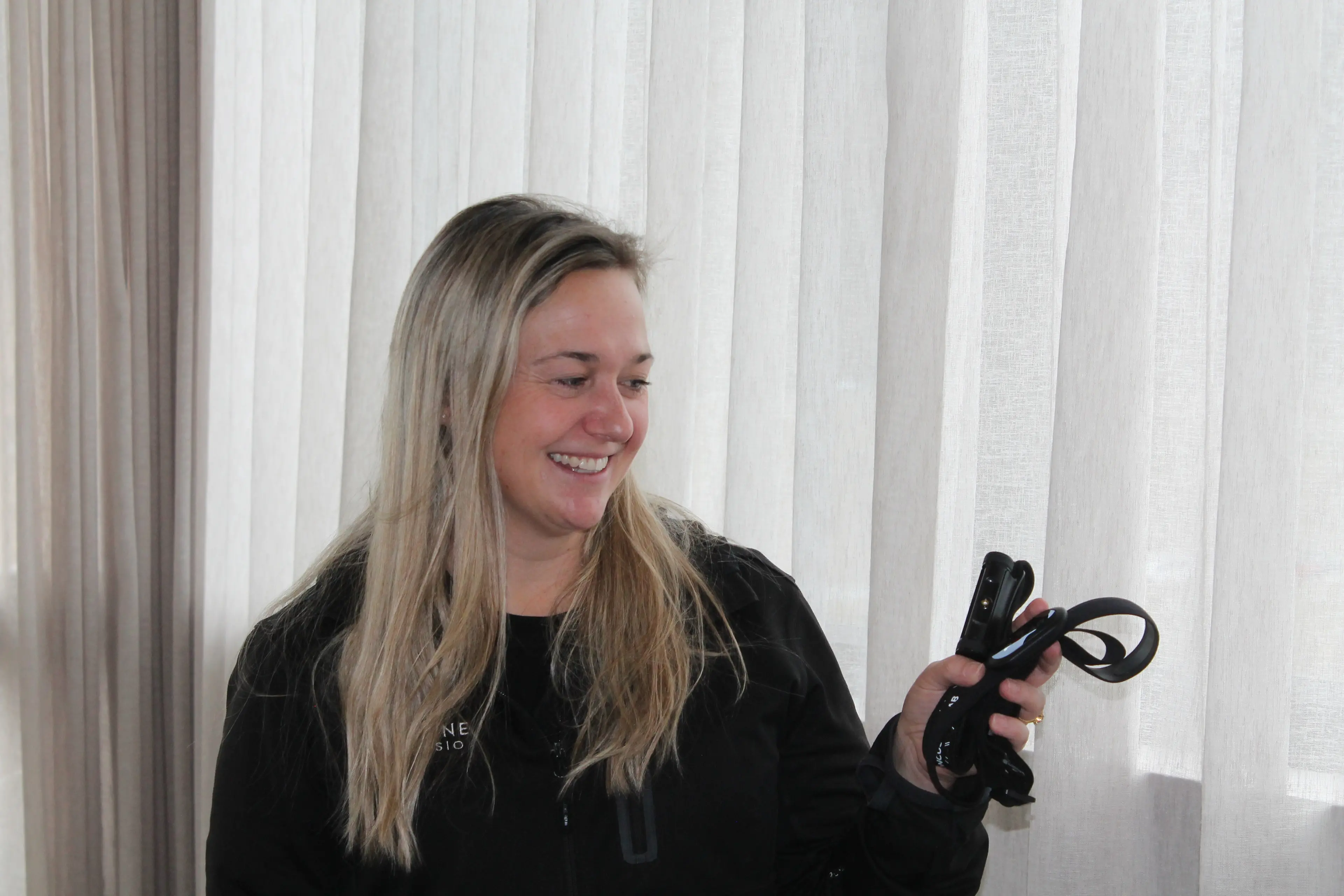 Alpine Physiotherapy director and concussion physio Sarah Brown with equipment used to test for concussions. Photo: Evie Sinclair