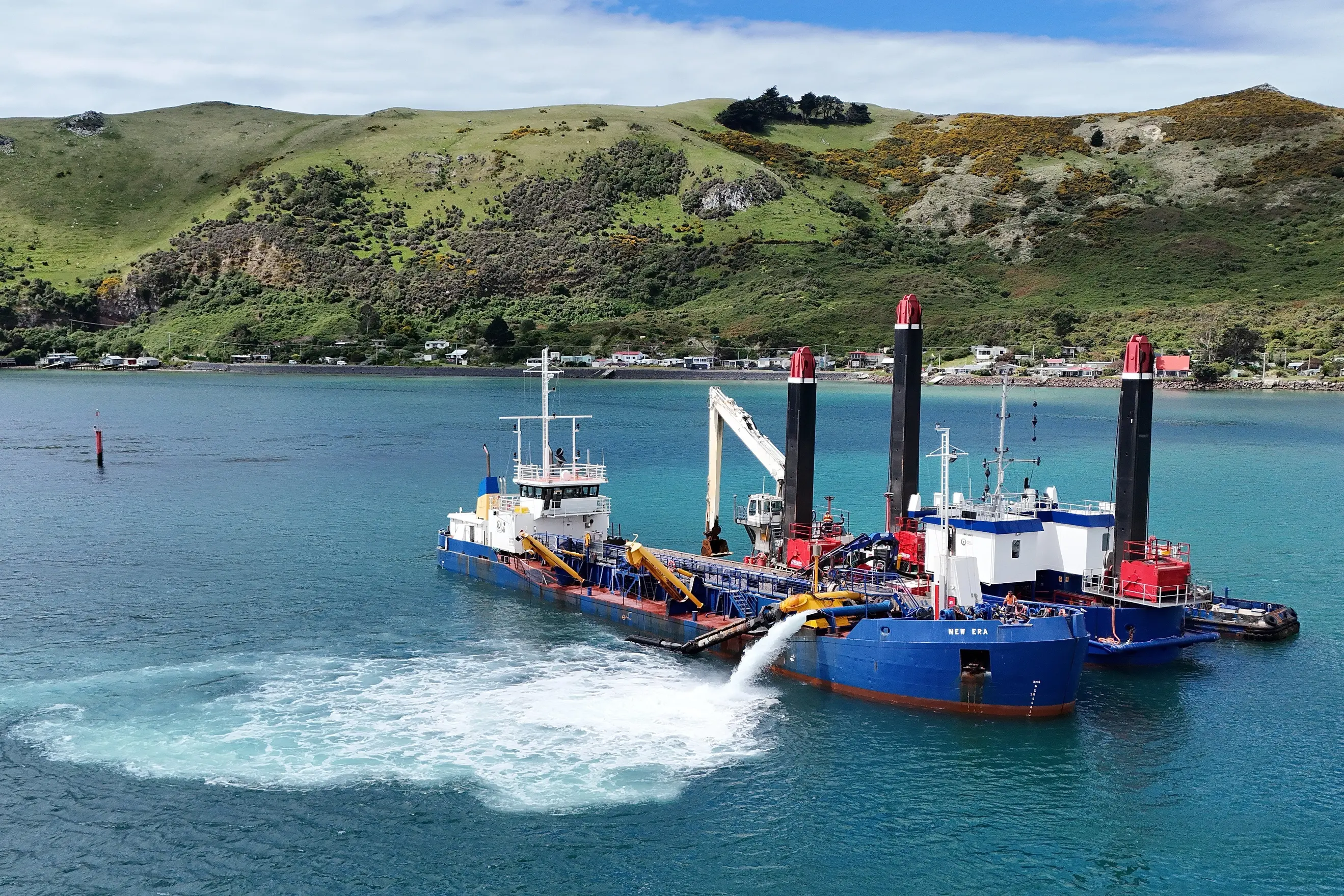 <p>Port Otago dredges 'Takutai' and 'New Era' work together during sand renourishment on Te Rauone Beach last year. Photo: Stephen Jaquiery</p>\\n