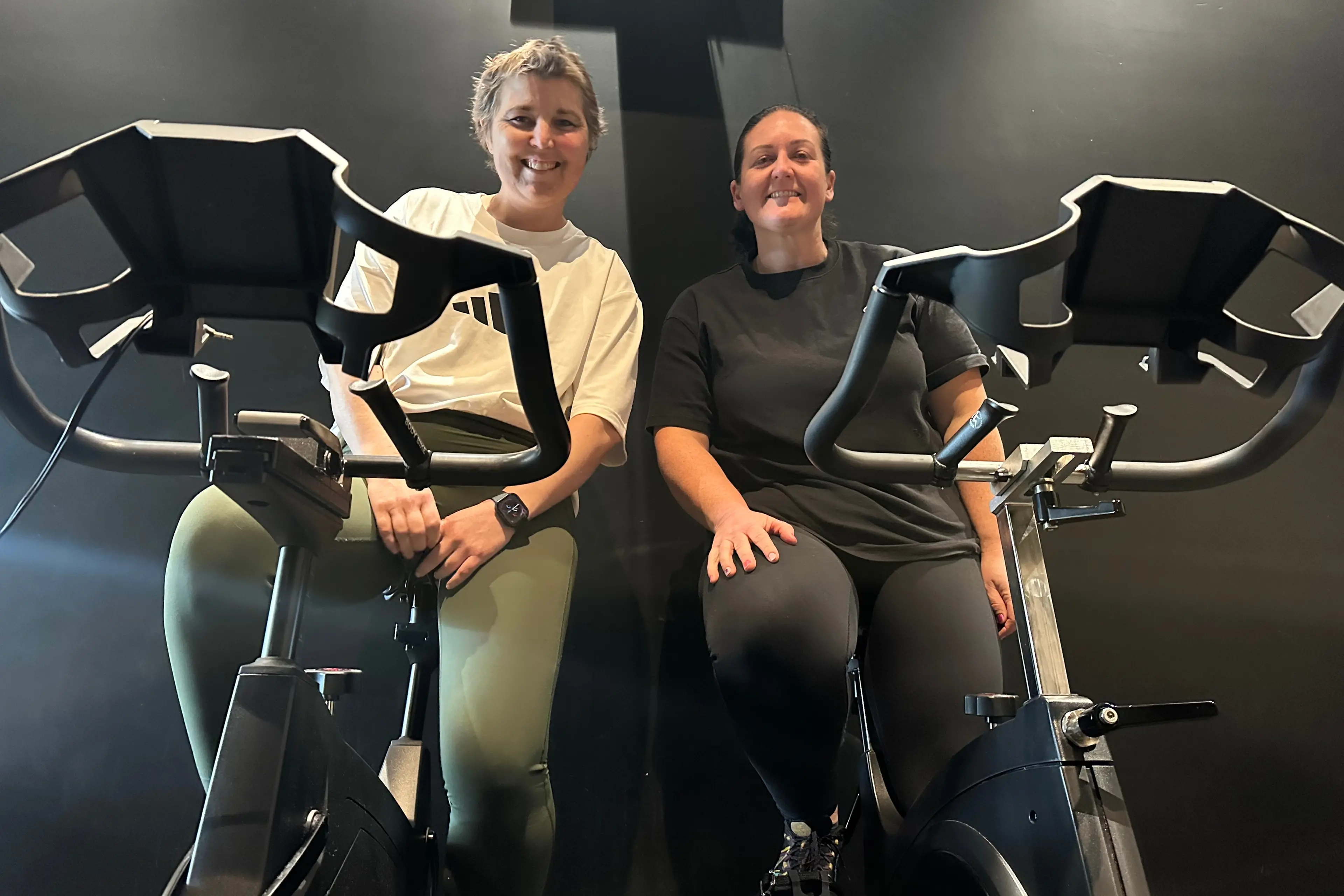 Courtney Sneesby (left) and Courtney Black try out the machines before pedalling starts in earnest on August 8 and 9 to raise funds for the North Canterbury Cancer Society. Photo: Supplied