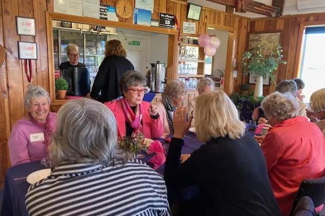 Fundraiser . . . Guests, including Hurunui Mayor Marie Black (right back) enjoy tucking into a hearty breakfast at the Ammual Amuri Golf Club\\'s Pink Breakfast. Photo: Supplied