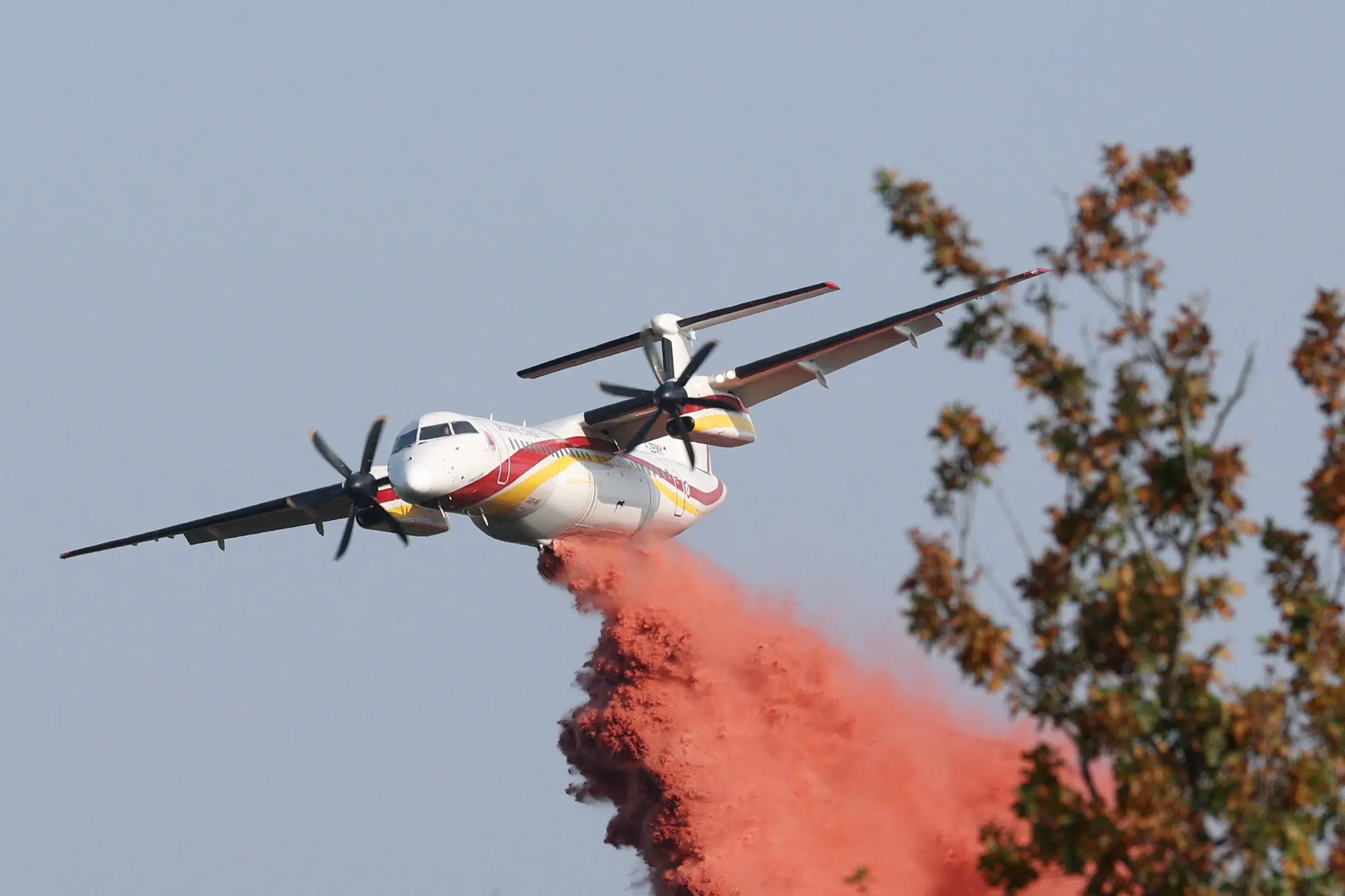 A firefighting plane drops fire retardant as efforts to battle wildfires in France continue. PHOTO: REUTERS