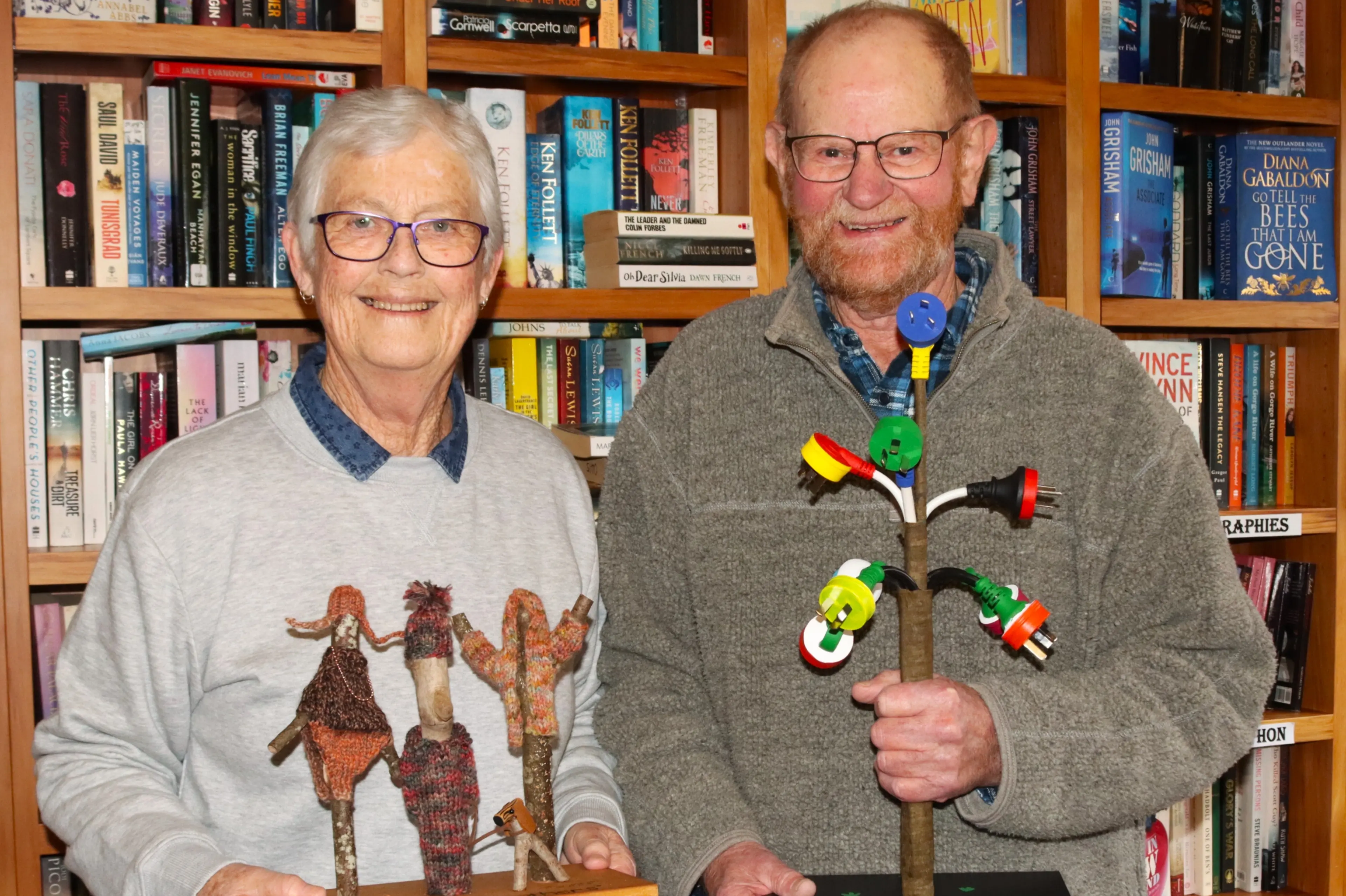 Brooklands Retirement Village couple Liz and Blue Heard show their imaginative creations. Mrs Heard created the \\'Stick Brothers\\', with their dog Woof, and Mr Heard created a \\'Power Flower\\' tree out of plugs. Photo: Sam Henderson