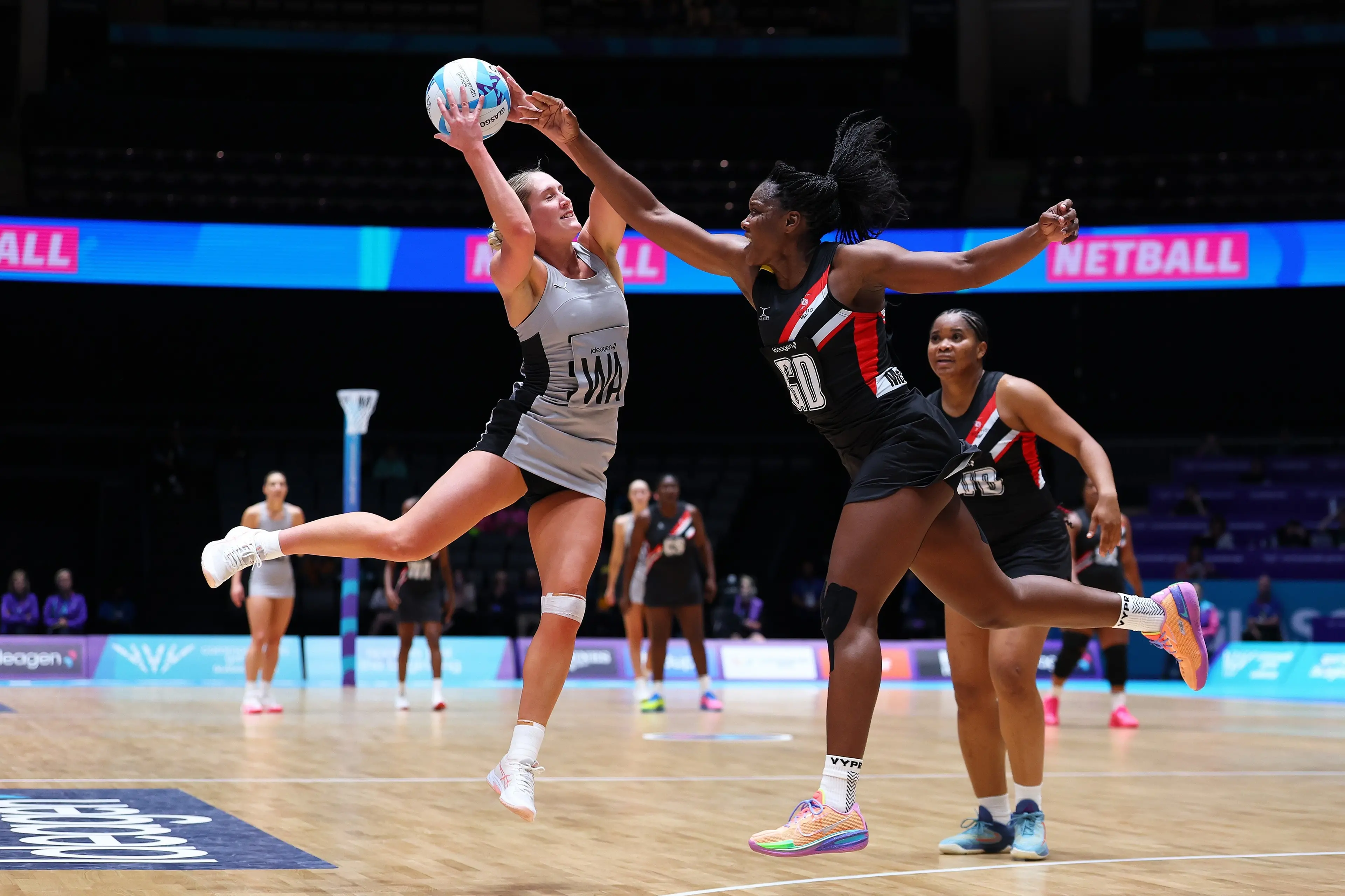Silver Ferns midcourter Maddy Gordon (left) controls the ball under the pressure of Trindad and Tobago defender\\u00A0Jeresia McEachrane during their\\u00A083-23 win at the Commonwealth Games in Glasgow on Friday. Photo: Getty Images