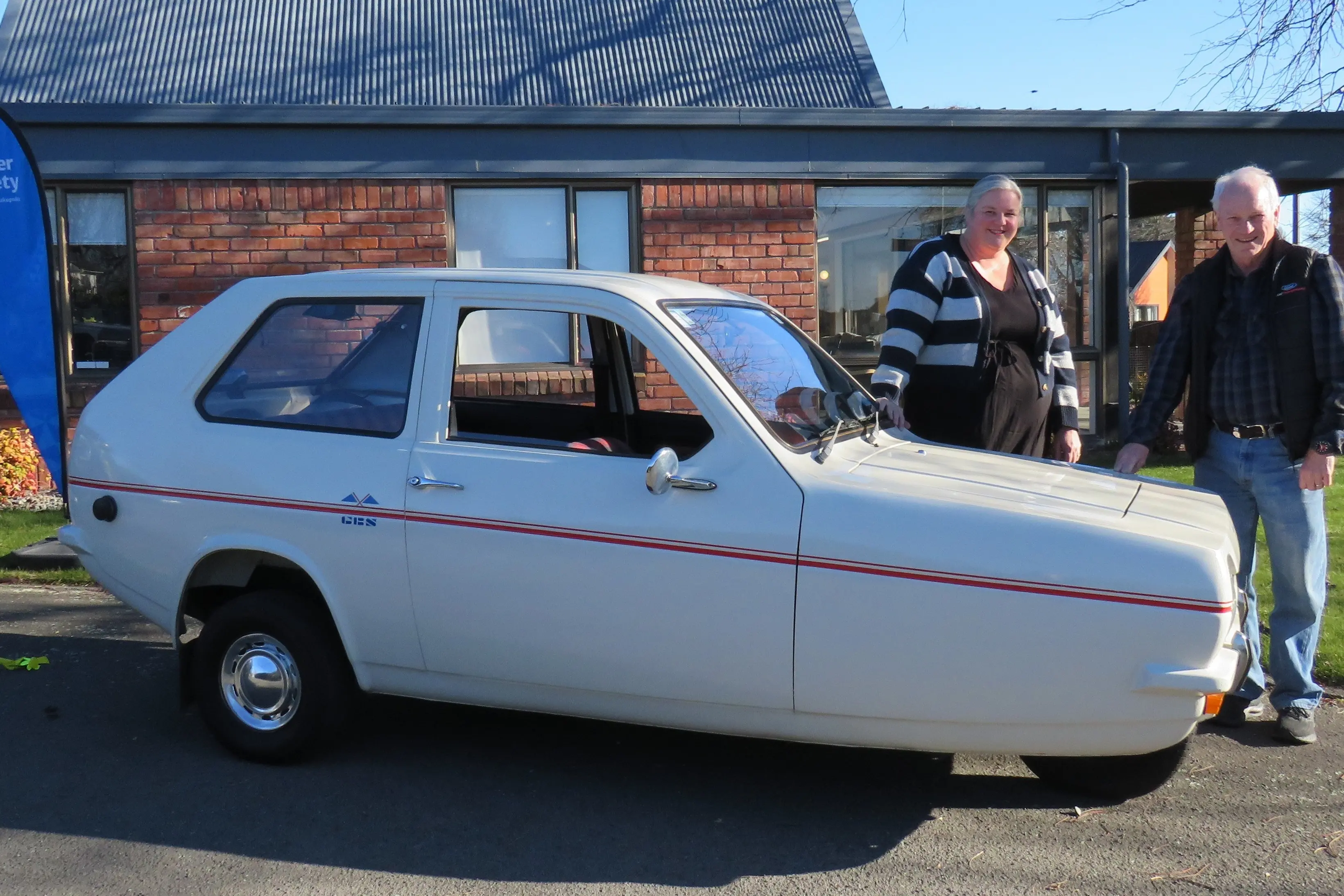 Cancer Society Mid Canterbury community manager Aimee Cosgrove (left) and Ashburton Vintage Car Club secretary Colin Sweetman with his 1978 Reliant Robin that will be on display at the annual Daffodil Rally for Cancer. Photo: Dellwyn Moylan