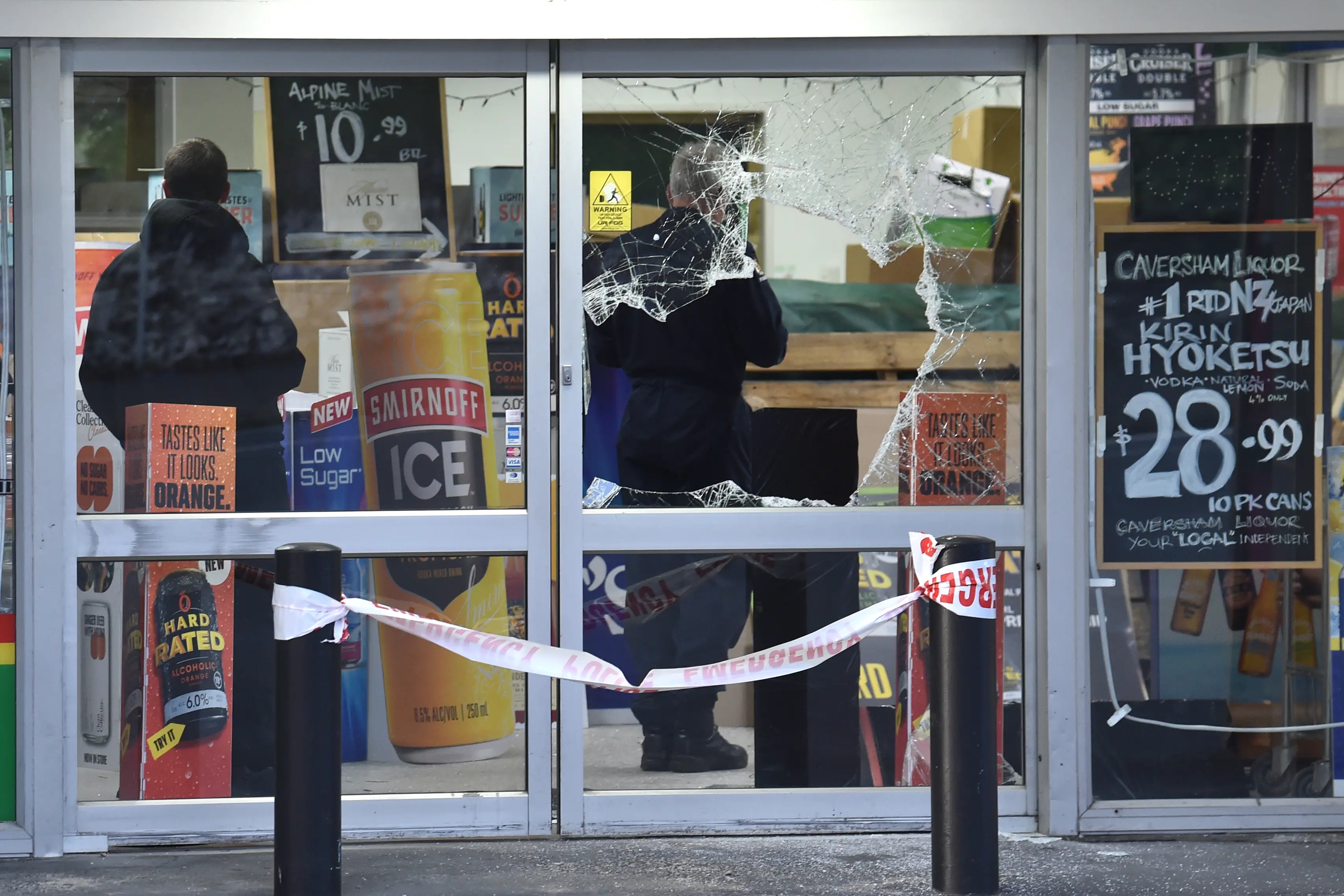 Two layers of glass doors were smashed during a break-in at Caversham Liquor in the early hours of Monday morning. Photo: Peter McIntosh