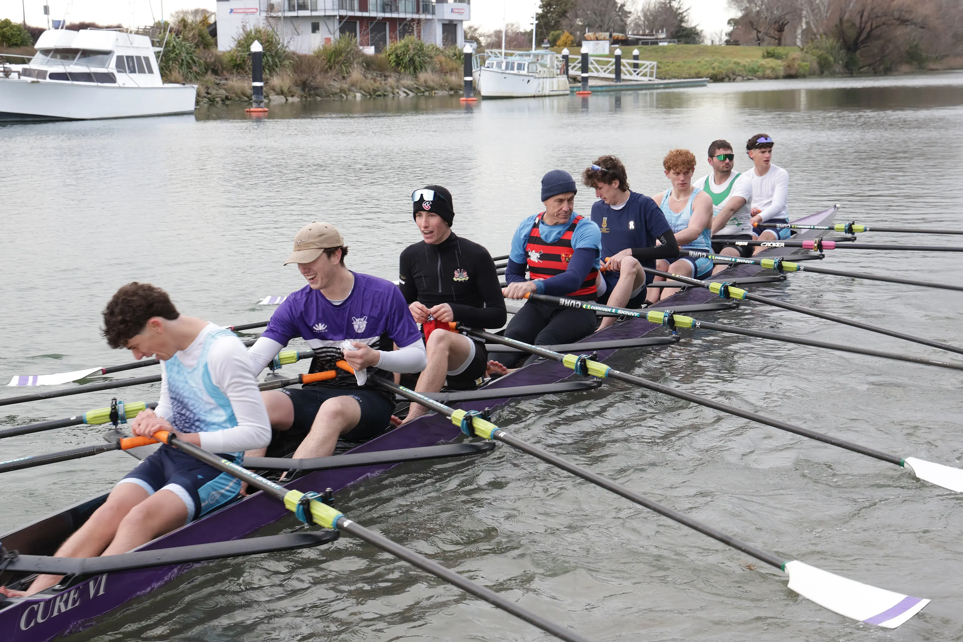 Easy does it . . . Members of the Cure Boating Clubs youth rowing programme, gently ease their \\u2018Octuple\\u2019 eight seater rowing boat out into the Kaiapoi River with Olympic Champion Rob Wardell (seated fourth from the left) along for the ride. Photo: John Cosgrove