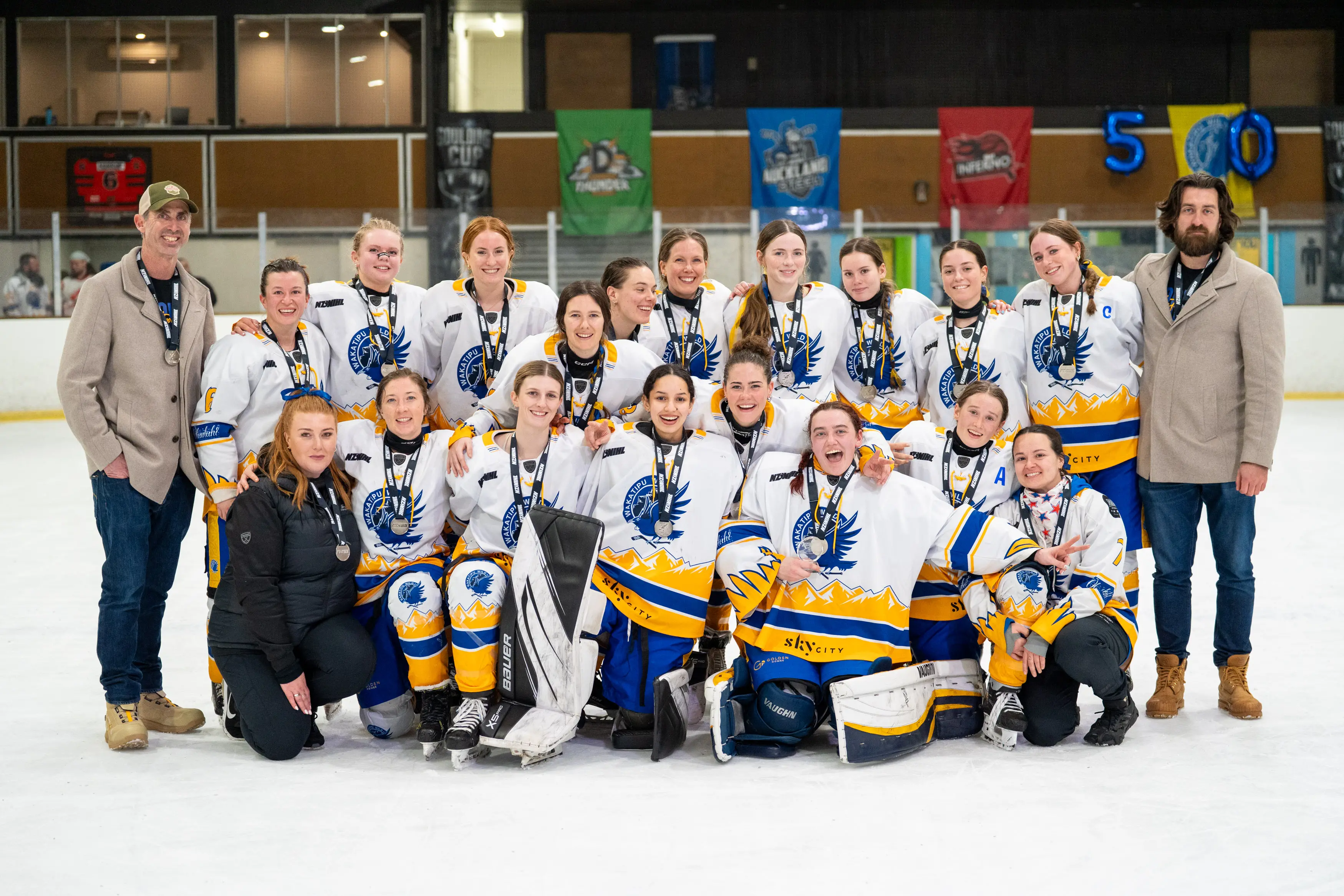 Wakatipu Wild players and management celebrate their silver medal in the New Zealand Women\\'s Ice Hockey League. Photo: NZWIHL