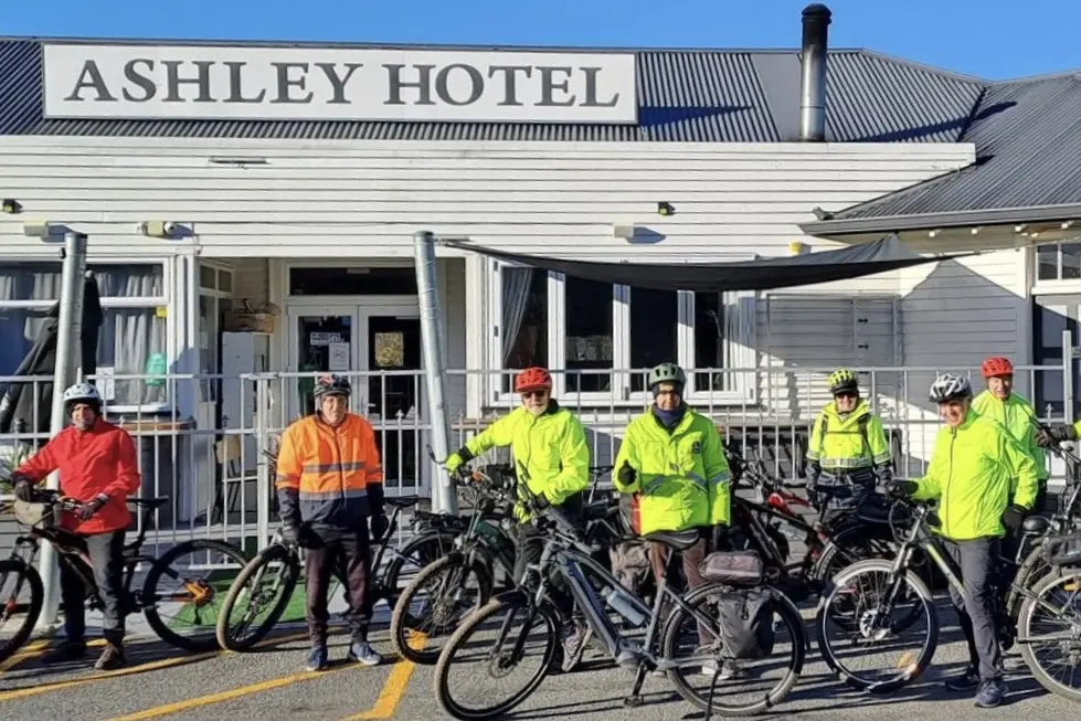 Trial run\\u2026 Members of the Kaiapoi Cycling Folk group outside Stamp Station Three at the Ashley Hotel, during a recent test run of the new W75 Trail, New Zealand\\u2019s first long\\u2011distance coastal and rural cycling art trail, which will be formally opened in Kaiapoi on Sunday, August 16. PHOTO: SUPPLIED