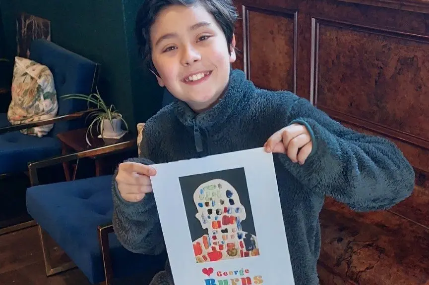 James Oh-Stephan with his artwork \"James with his head full of books\\'\\'. Photo: Supplied