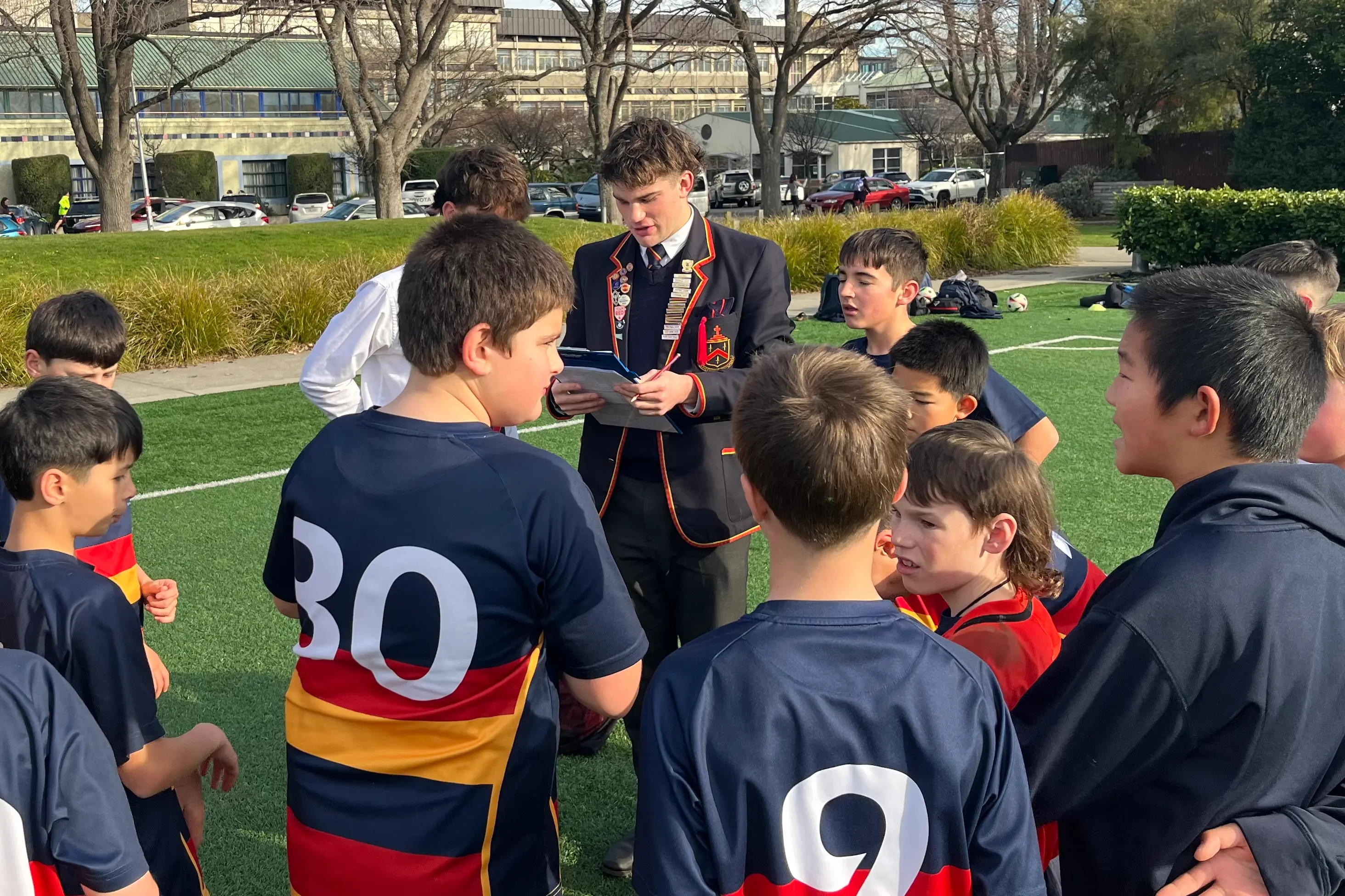 John McGlashan College student Will Laws coaches his younger schoolmates. Photo: Supplied