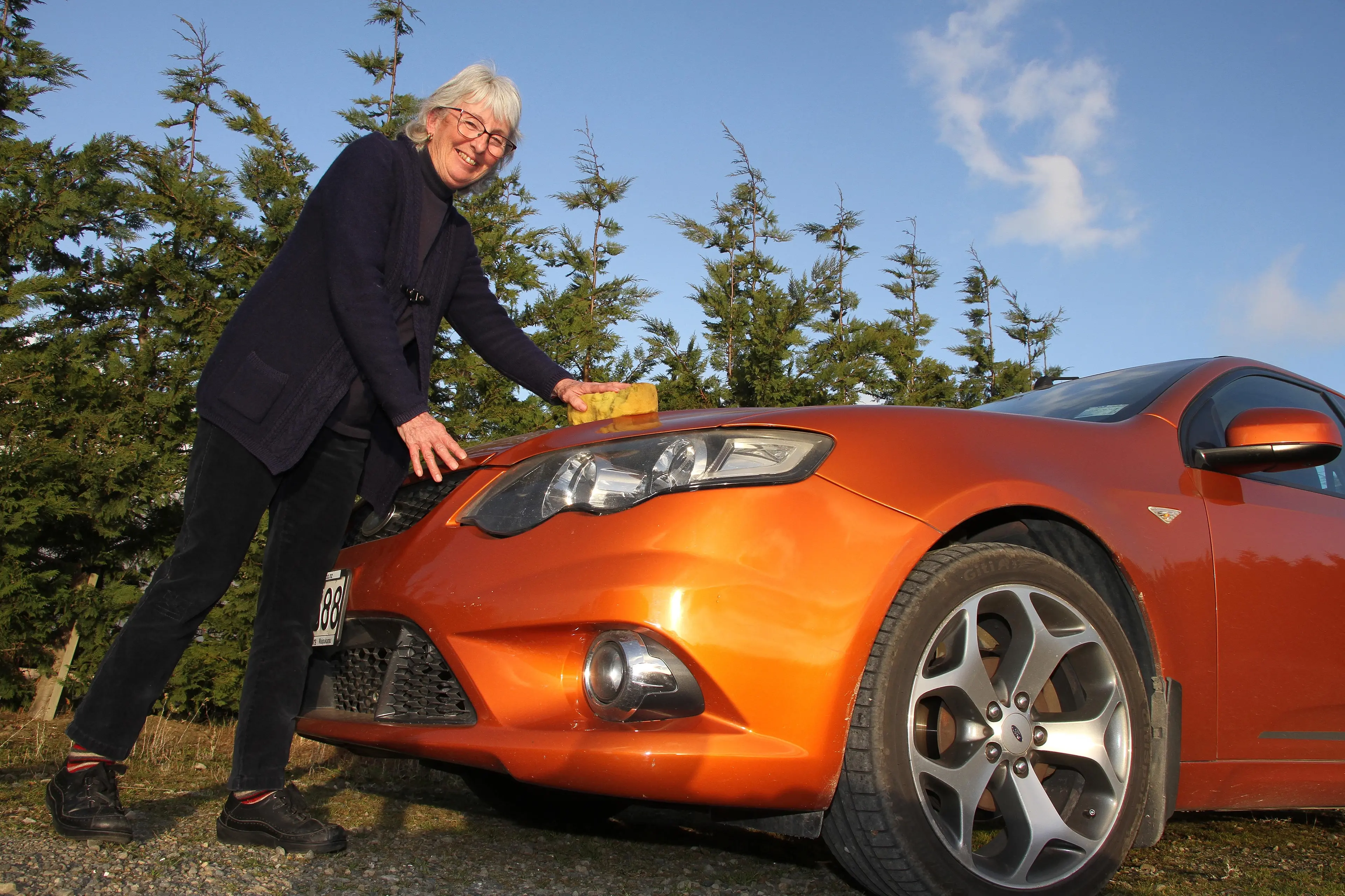 Giving her a buff up  . . . Lynn Hey of Amberley, cleans her Ford XR50 ute in preparation for the VCC Daffodil Rally for Cancer later this month. Photo: John Cosgrove