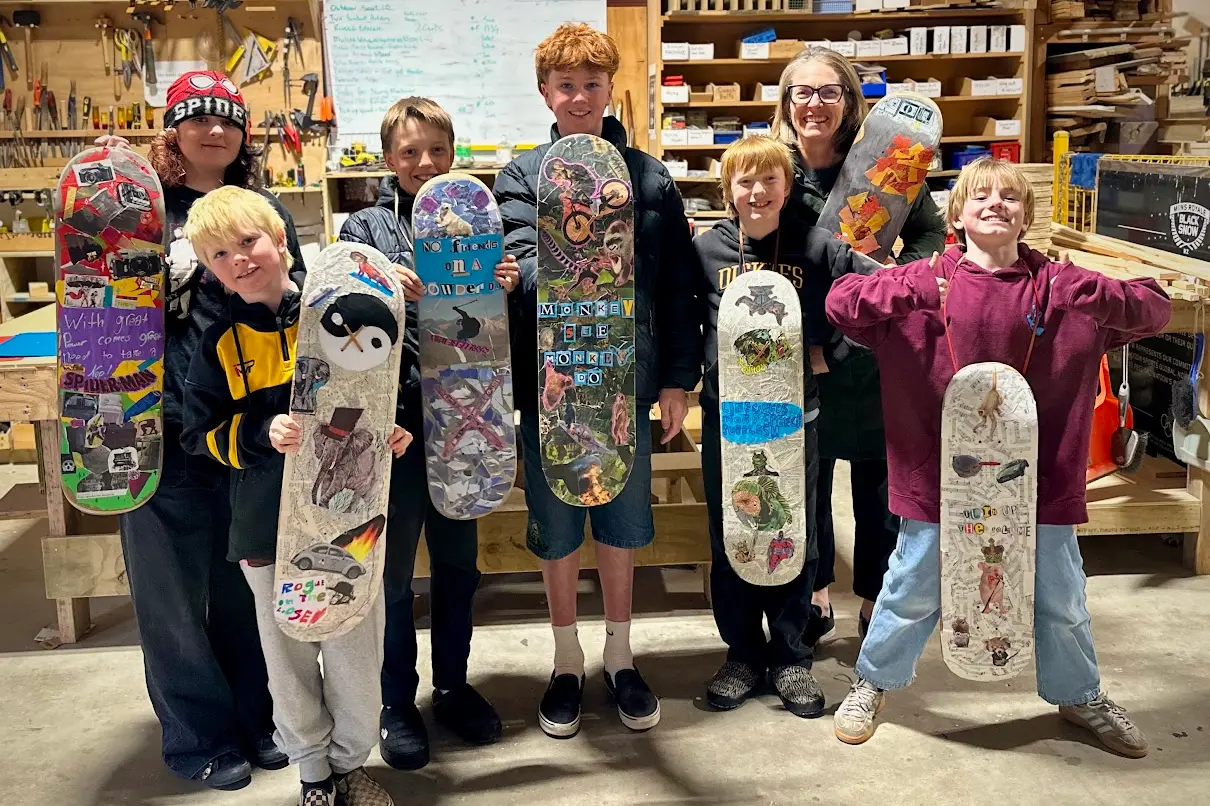 Kirsty Taylor and children participating in the first skateboard collage workshop during the recent school holidays. Photo: Supplied