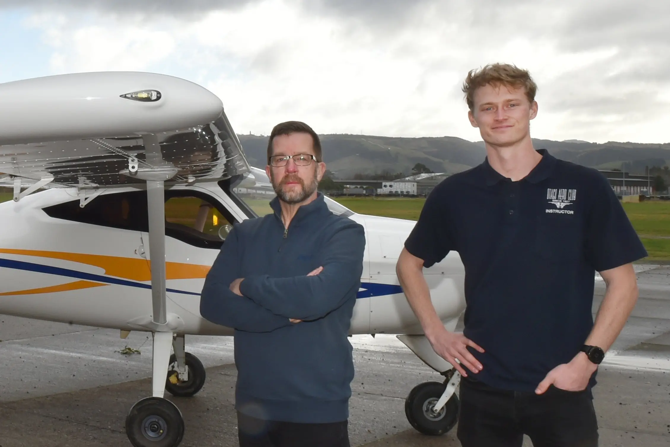 Otago Aero Club centennial committee member Chris Hinch (left) and chief instructor Henry Luke at the club\\'s aerodrome on Monday. Photo: Gregor Richardson