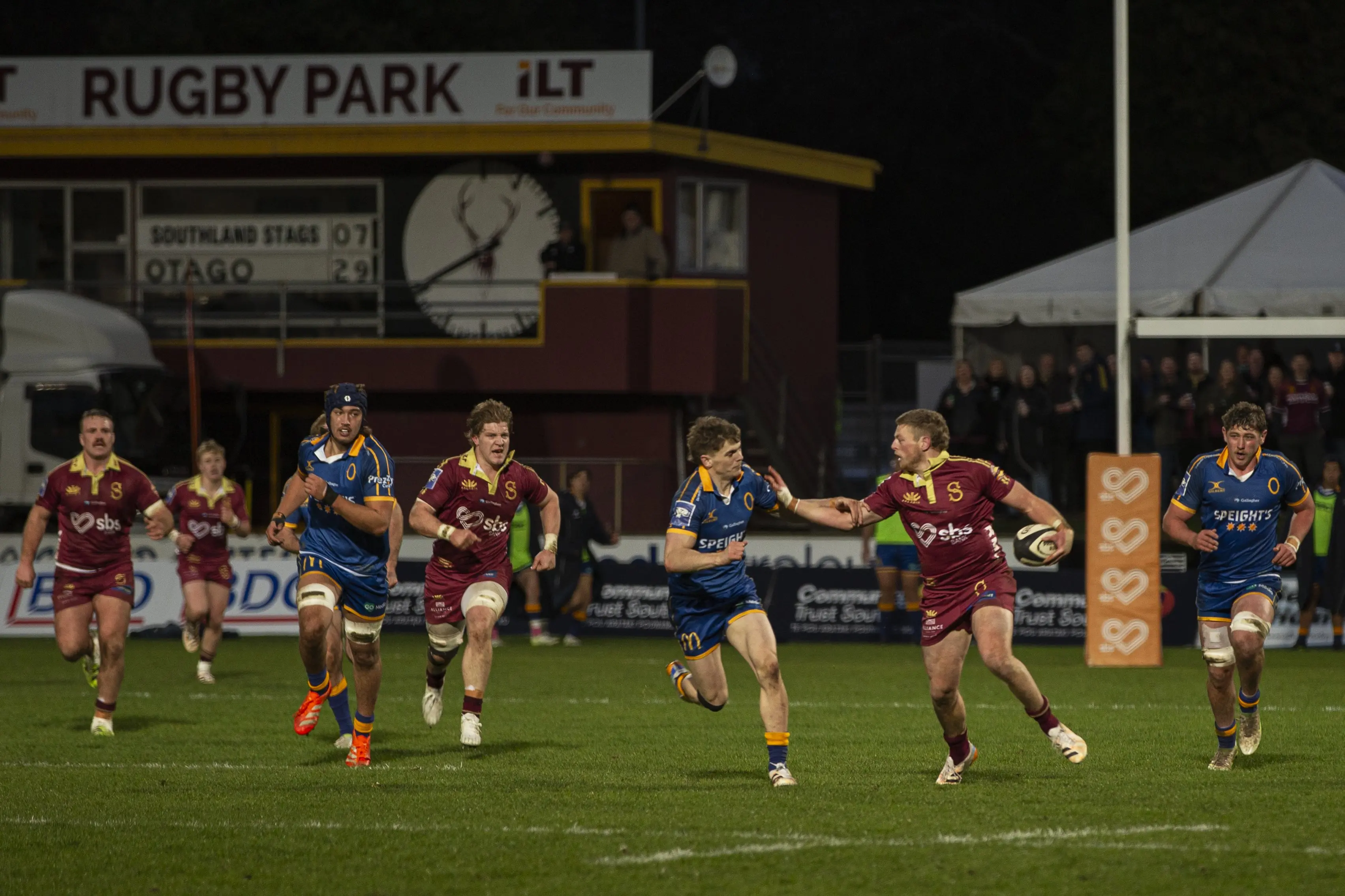 Otago fullback Sam Nemec-Vial attempts to tackle Southland second five Scott Gregory. Photo: Daryll Winter Photography