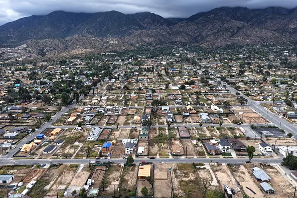An aerial view of houses being rebuilt amid cleared lots where homes were destroyed by the Eaton fire in Altadena in January last year. Photo: Getty Images