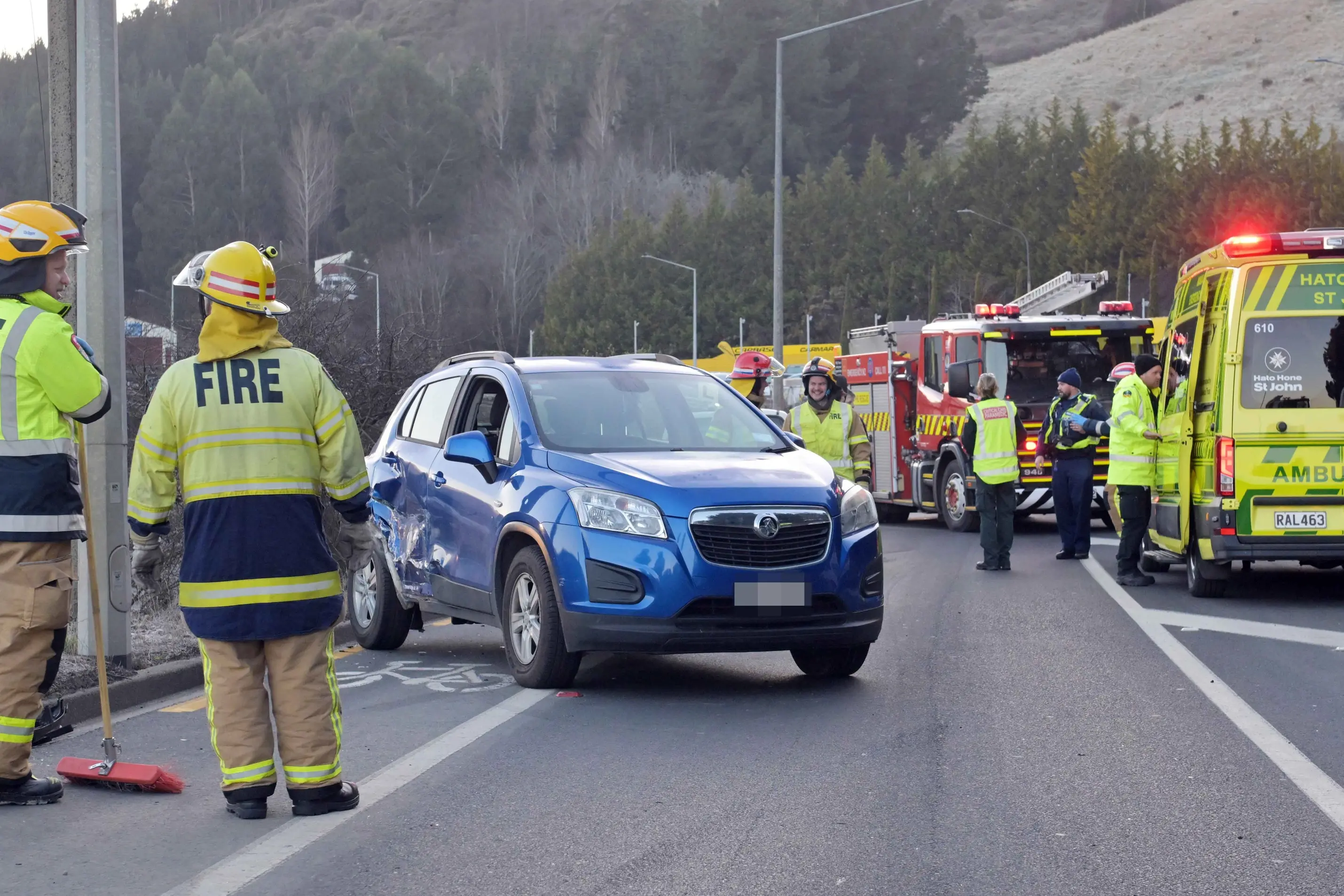 Emergency services attend the scene of a two-vehicle crash in Kaikorai Valley Rd. Photo: Gerard O\\'Brien