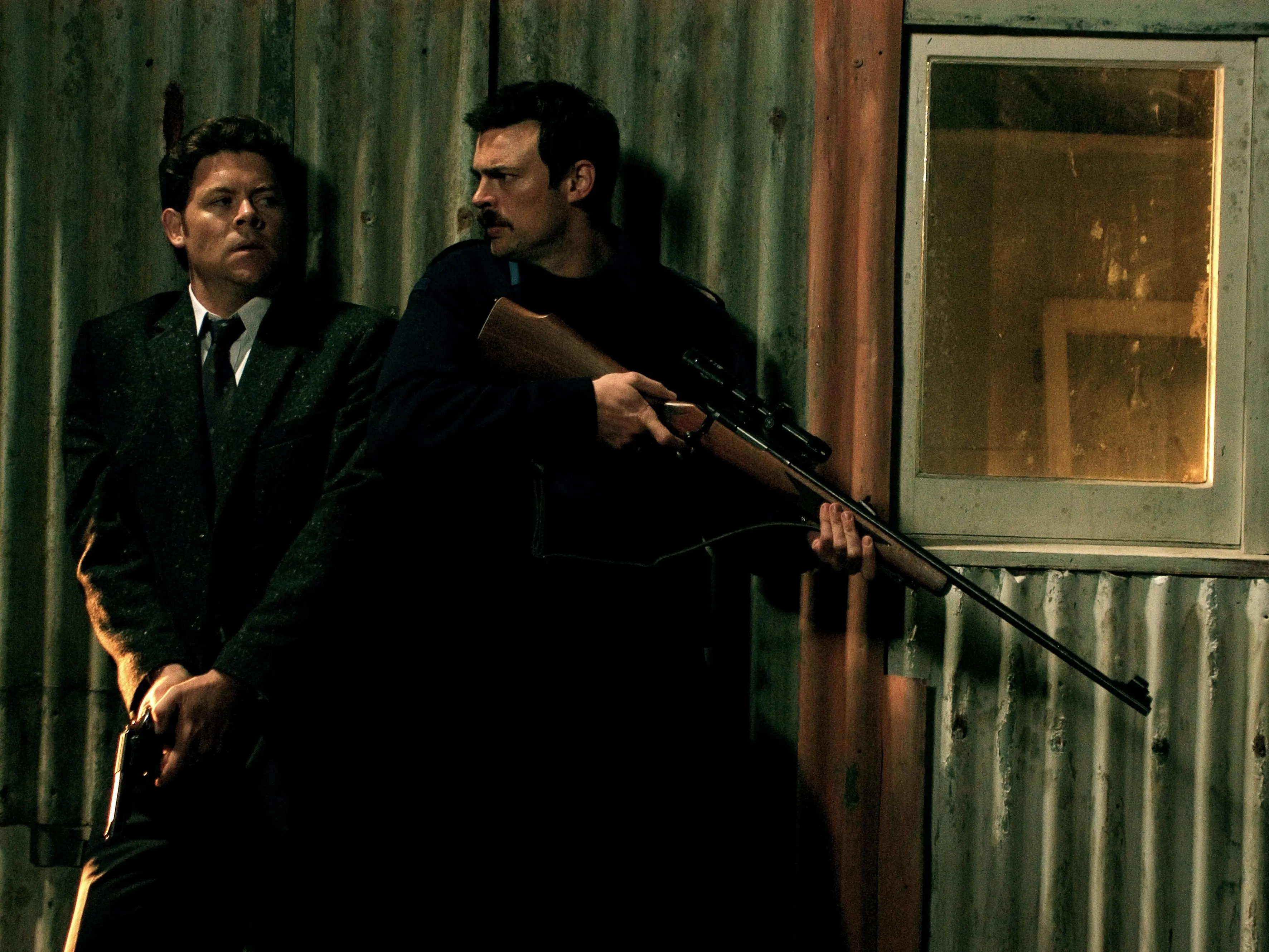 Actors Paul Glover (left), as Detective Paul Knox, and Karl Urban, as Constable Nick Harvey, in \\'Out of the Blue\\'.