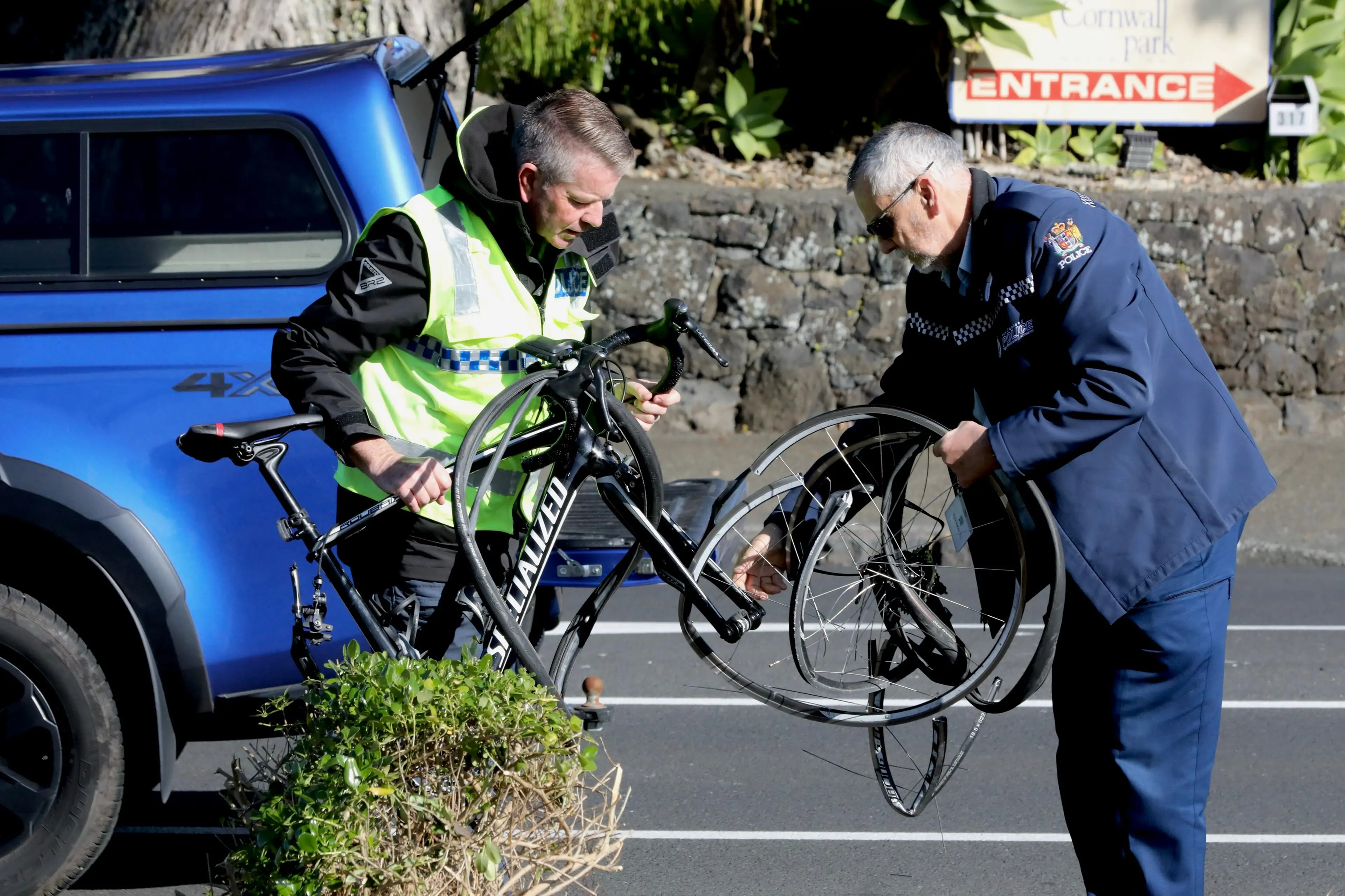 Police with a mangled bicycle at the scene on Wednesday. Photo: RNZ