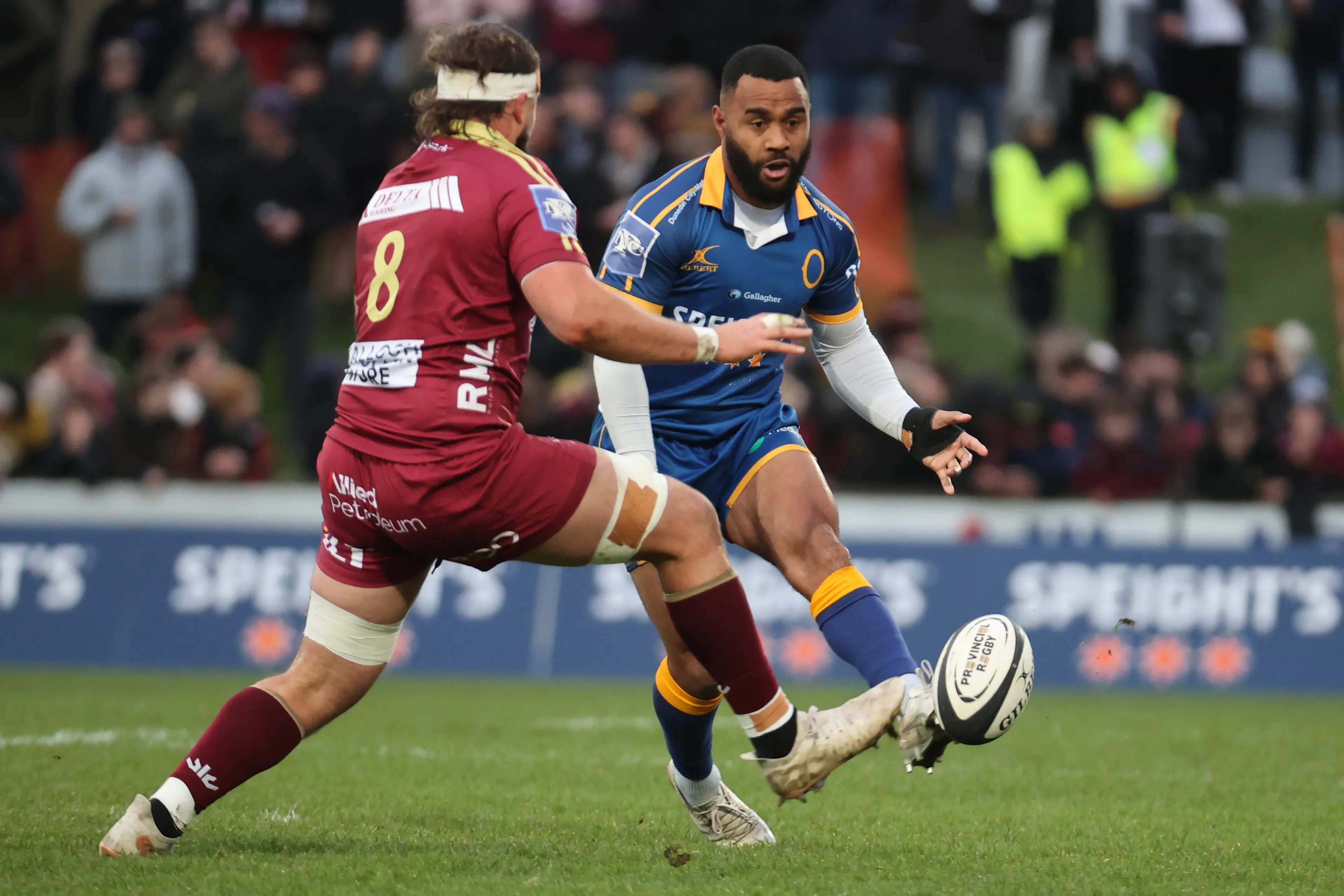 Otago winger Jona Nareki chips a kick past Southland No 8 Sam Fischli during an NPC game in Invercargill on the weekend. Photo: NZ Rugby/Smartframe