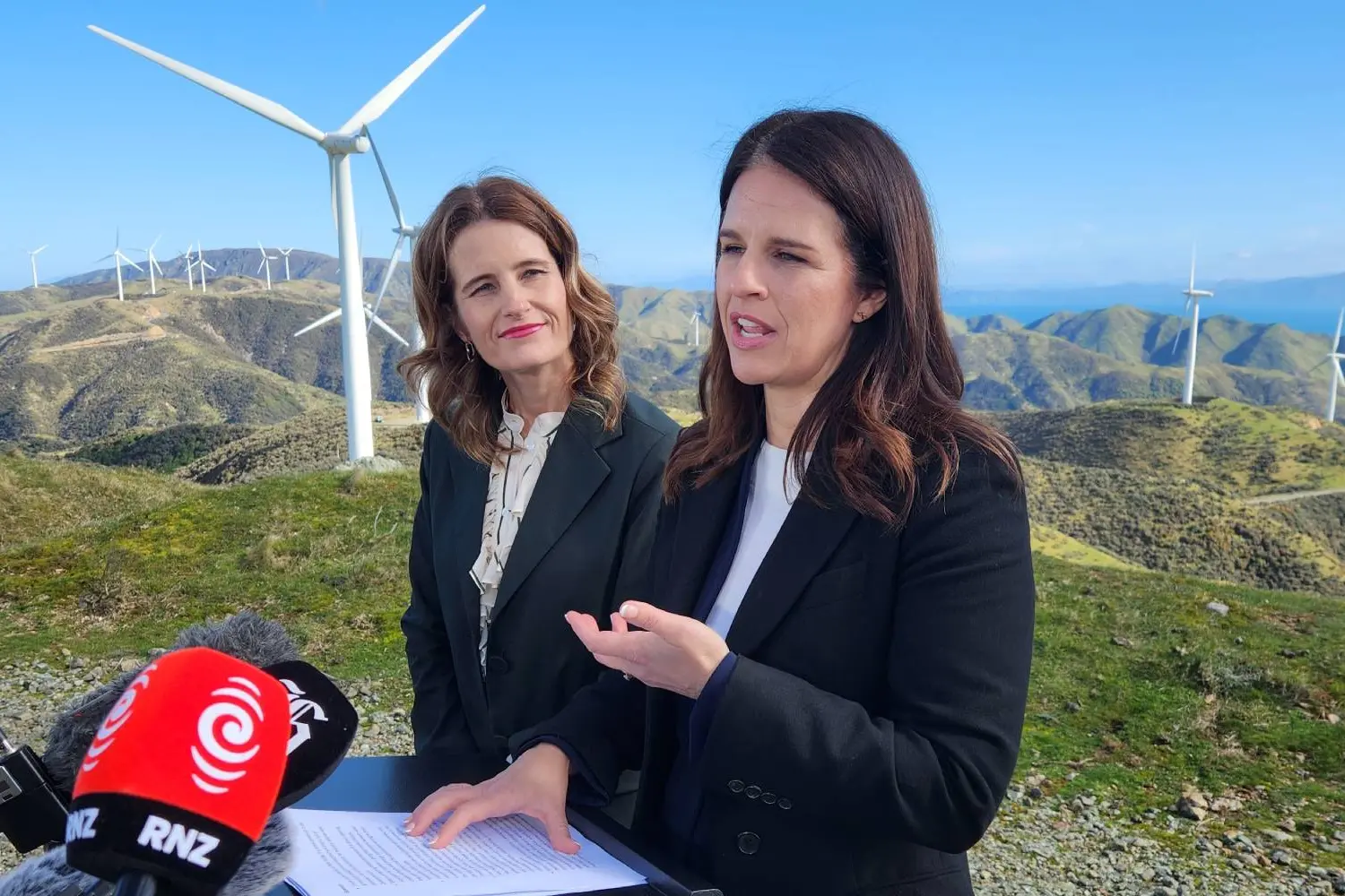 Nicola Willis and Erica Stanford announce new school subjects at Makara windfarm. Photo: RNZ