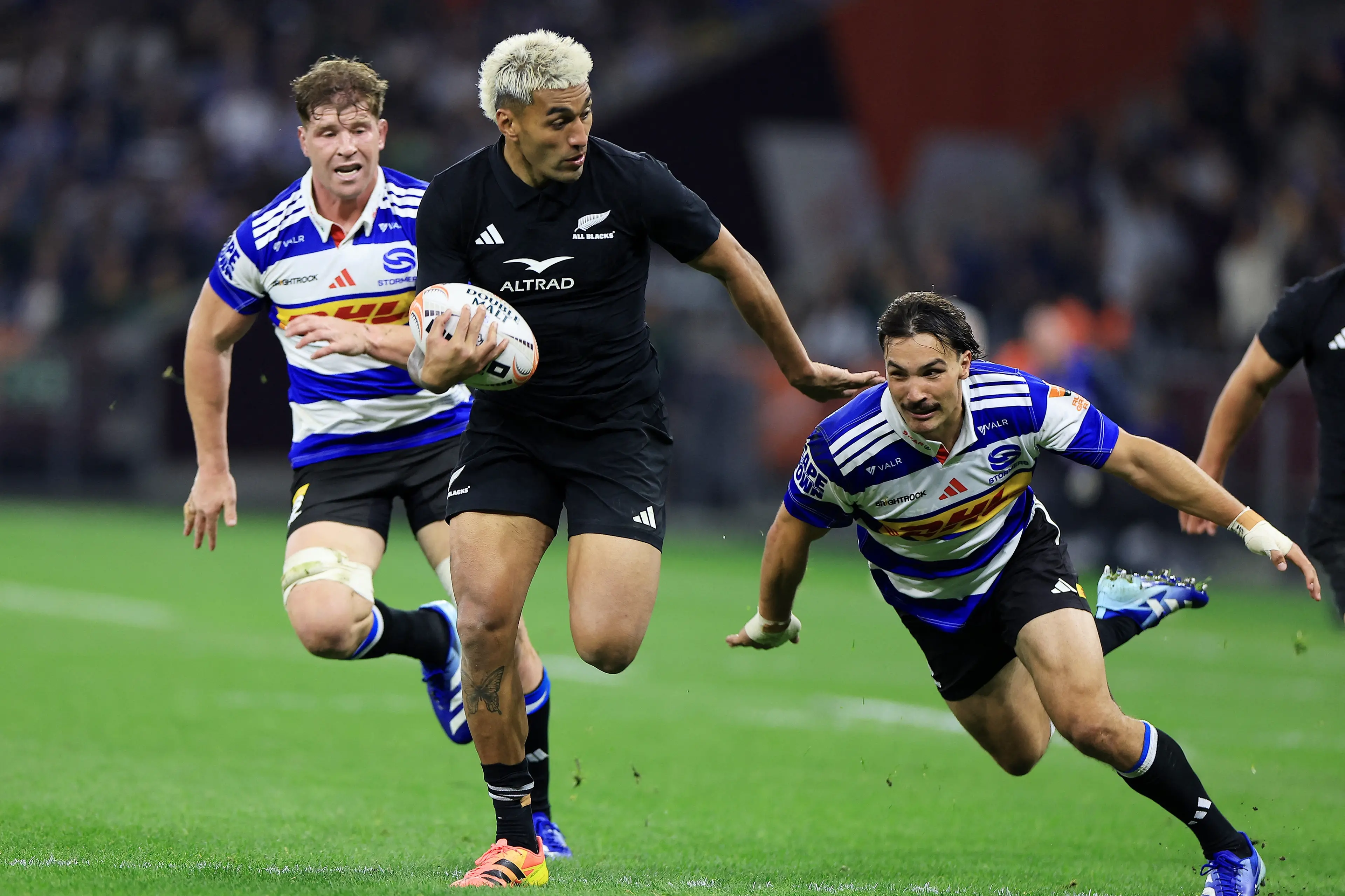 <p>Rieko Ioane evades the tackle of Jonathan Roche of the Stormers in Cape Town. Photo: Reuters</p>\\n