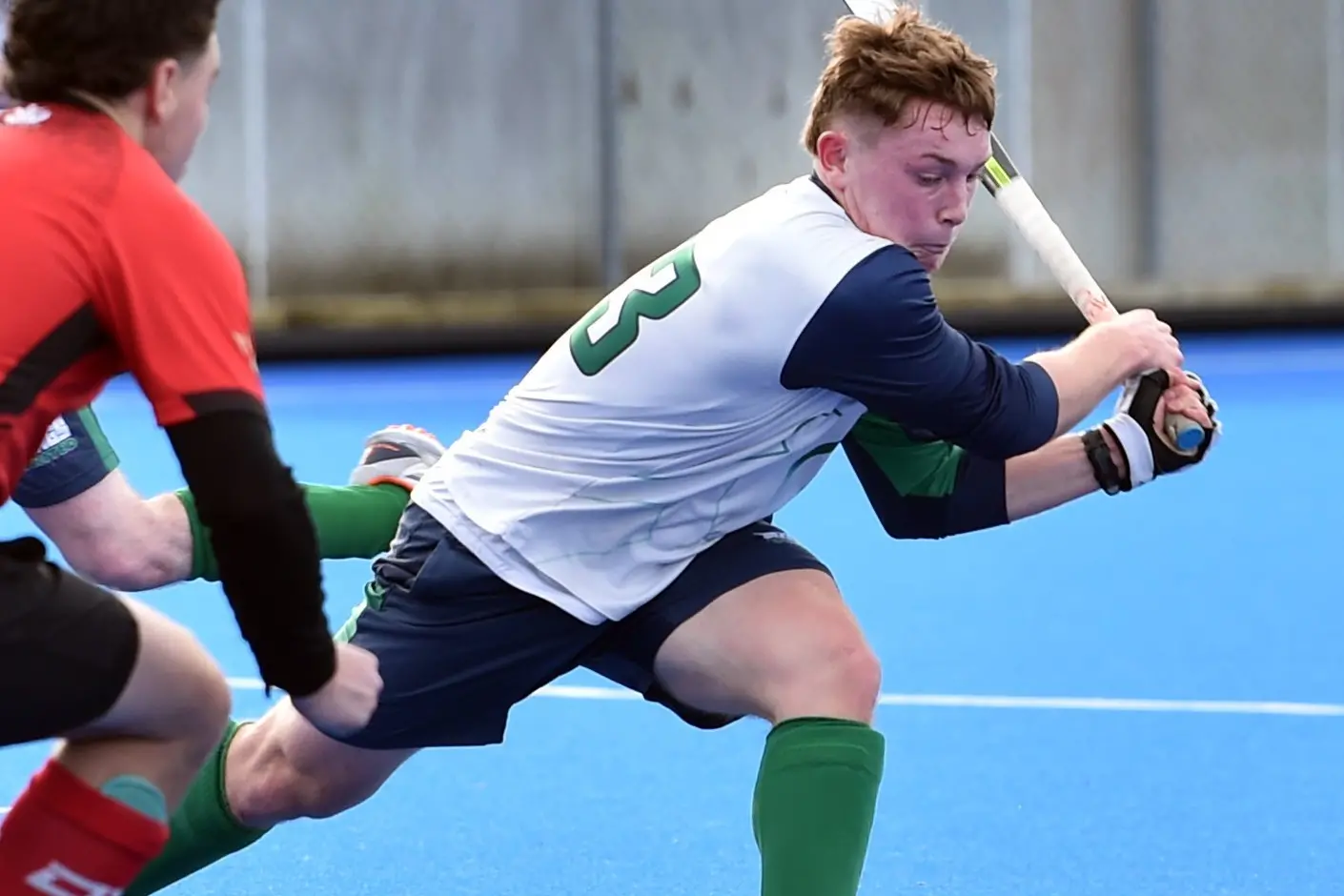 Kings United Cobras striker Mason Kingan gives it a whack past Albany Alligators defender Johnny Thorn during the Dunedin premier men\\'s hockey game at the McMillan Centre on Saturday. Photo: Peter McIntosh