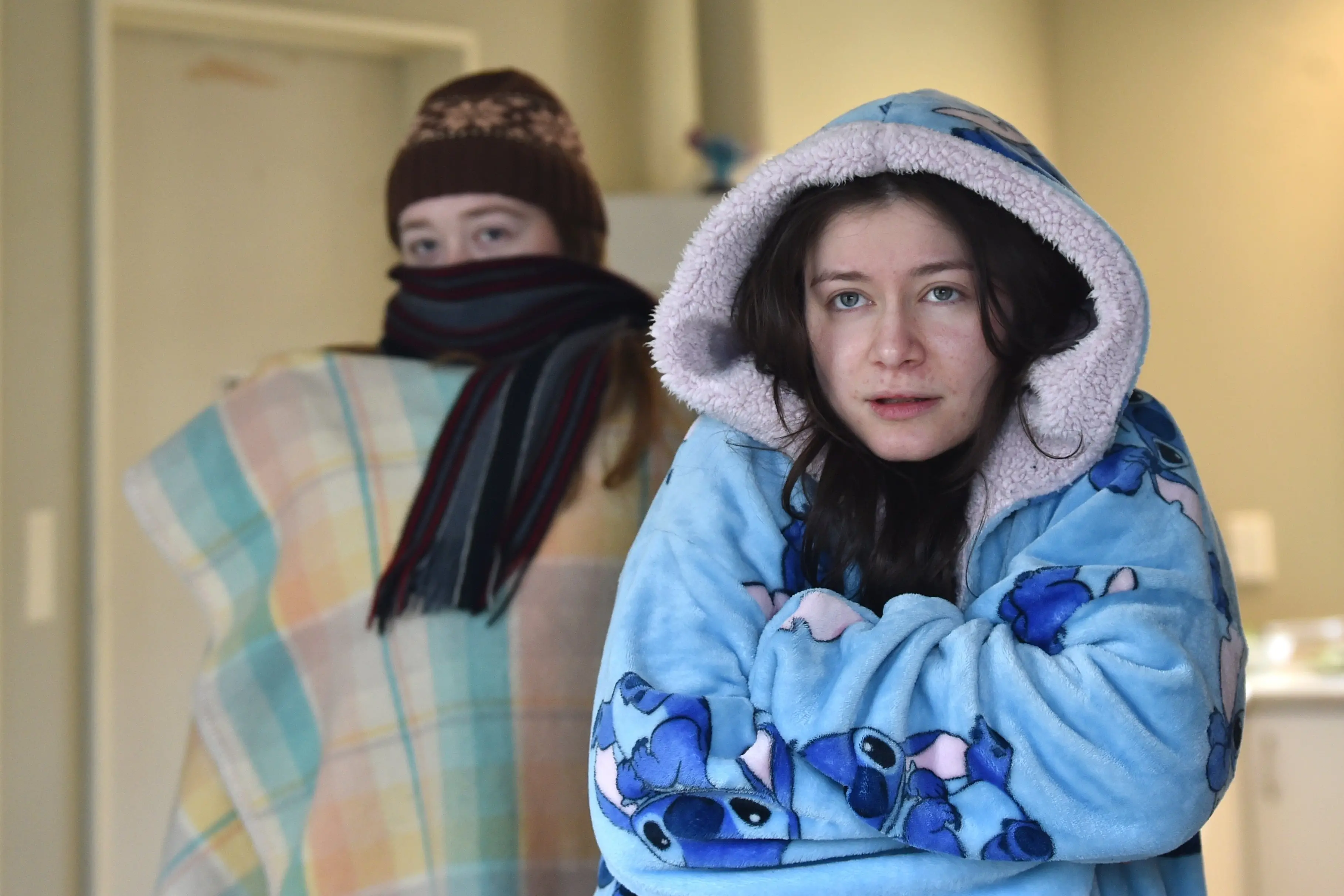 University of Otago student Victoria Clark (left) and her flatmate Jess Chin Shong say their flat was cold during the recent power outages. Photo: Peter McIntosh