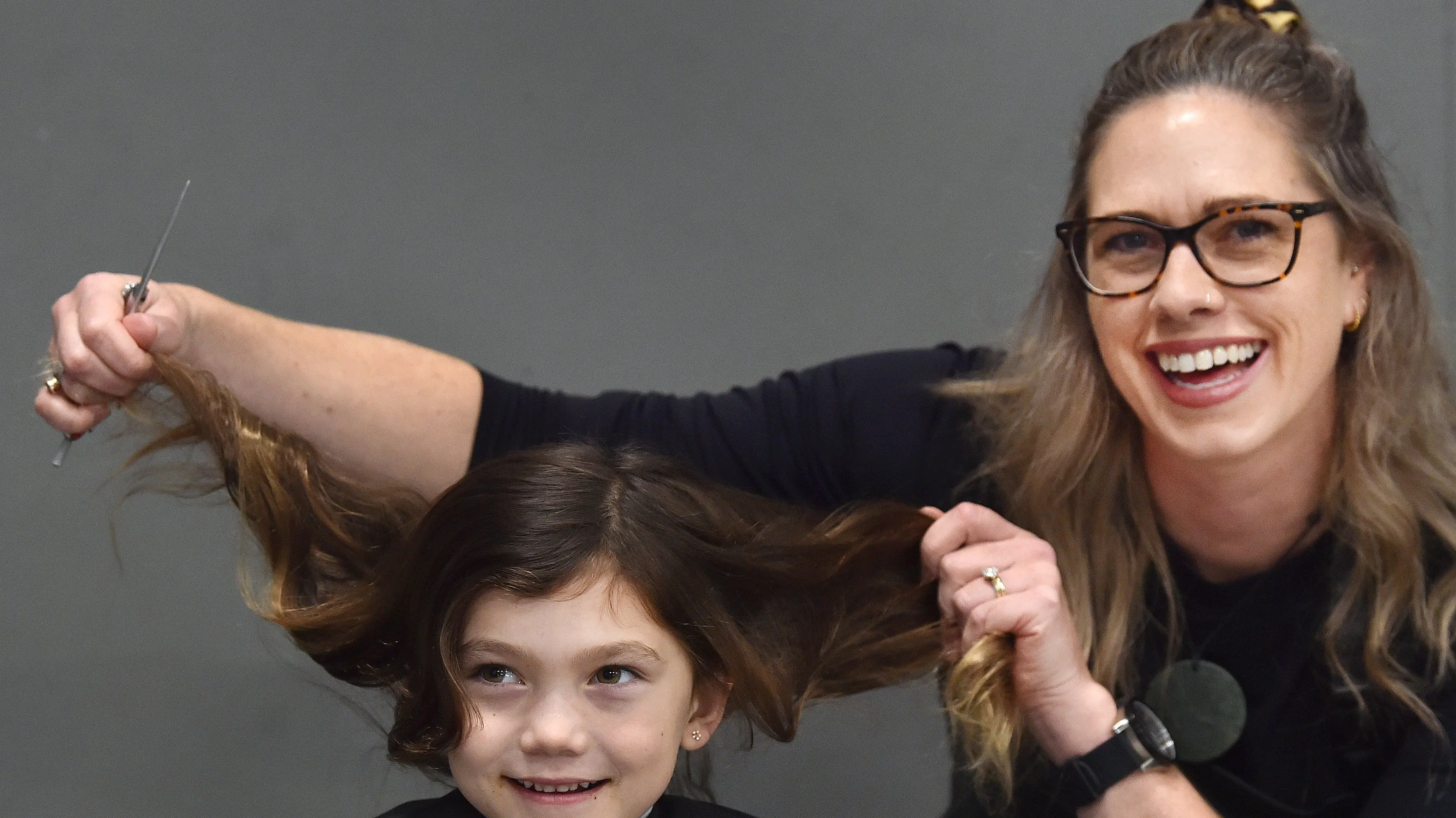‘Such a beautiful day’: Free haircuts a help for hundreds