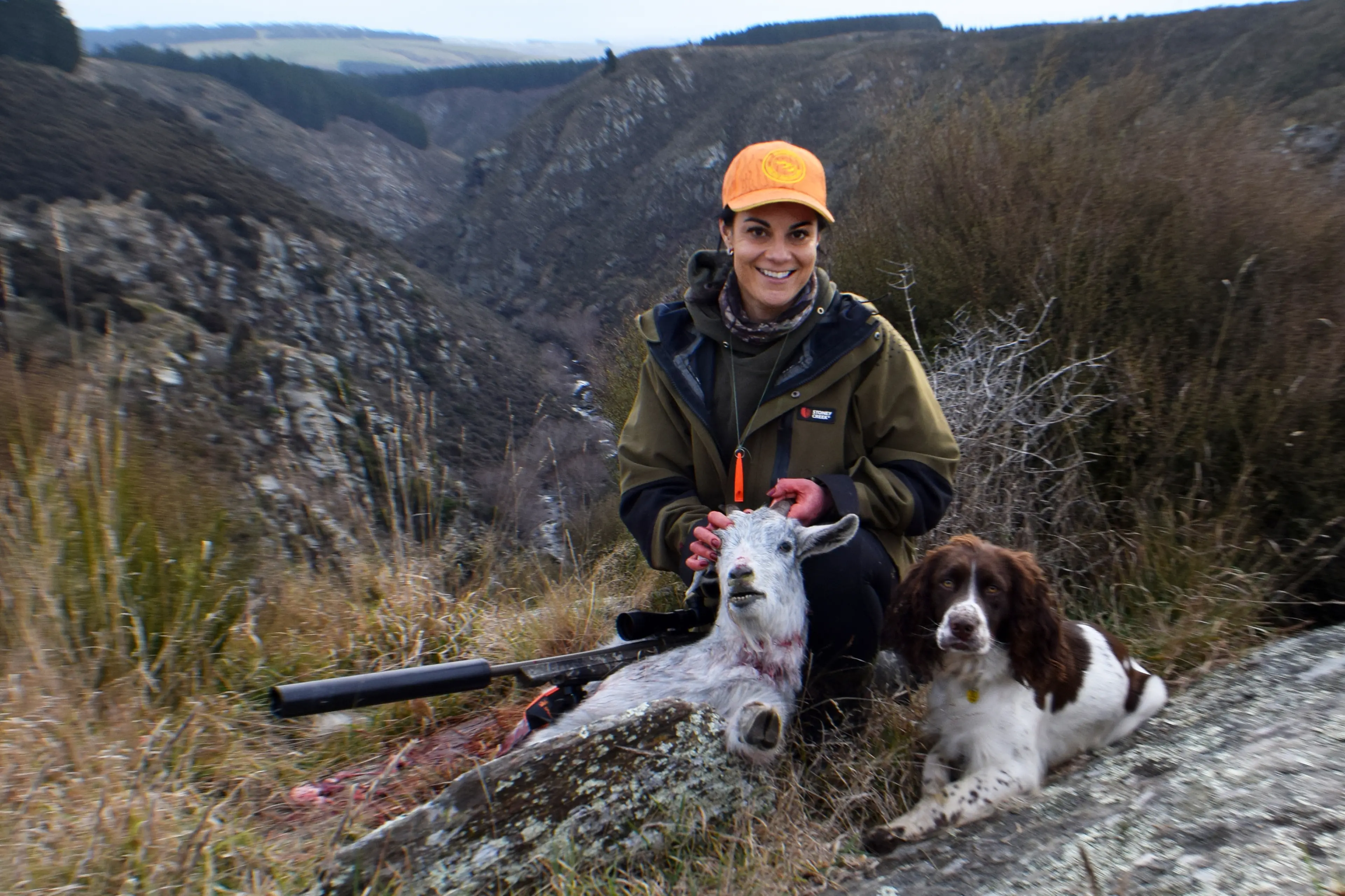 Chantalle Harrison, of Dunedin, with her dog Dixie, with an entry in the National Wild Goat Hunting Competition, after an expedition in Hindon this month. Photo: Shawn McAvinue