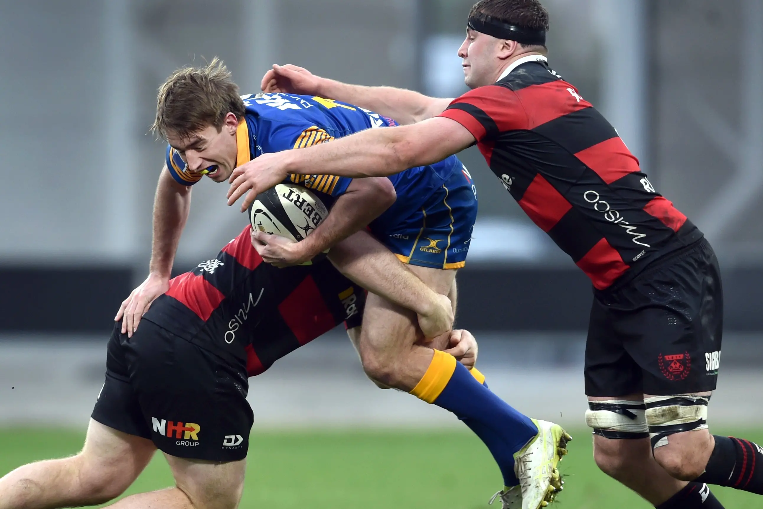 Otago first five Cameron Millar is sandwiched in a tackle by Canterbury players Seb Calder (left) and Dominic Gardiner during a Ranfurly Shield match at the Forsyth Barr Stadium on Sunday. Photo: Peter McIntosh