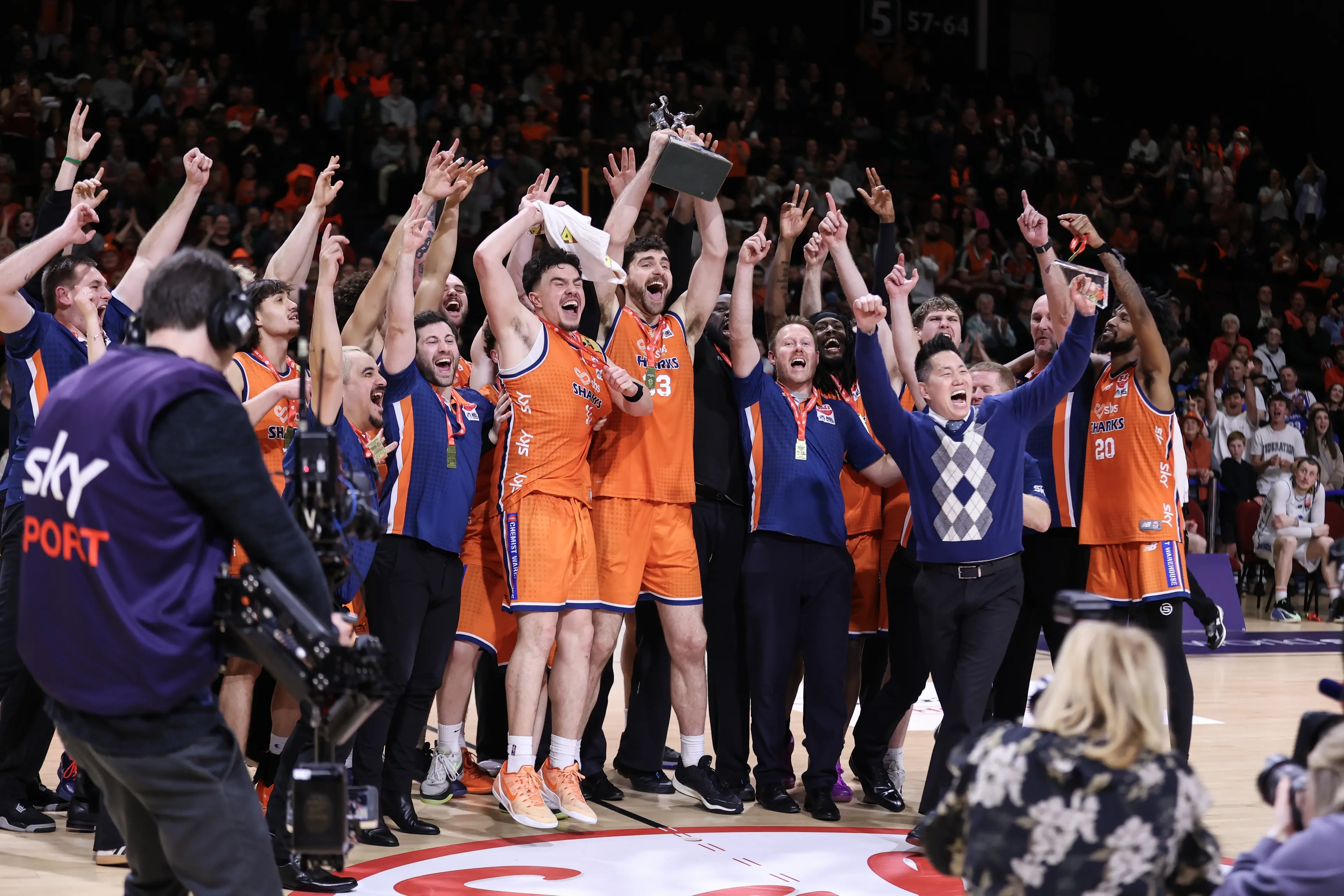 The Southland Sharks celebrate winning the NBL in front of a sold out crowd at Stadium Southland on Sunday. Photo: Monica Toretto.