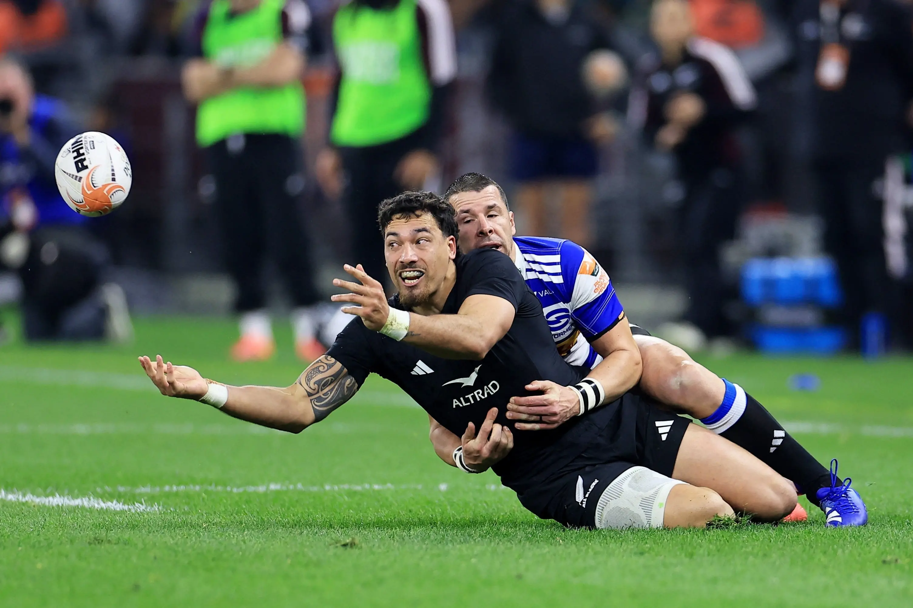 All Blacks centre Billy Proctor tries to get the ball away in the tackle of Stormers opposite Ruhan Nel during the game in Cape Town on Saturday. Photo: Reuters