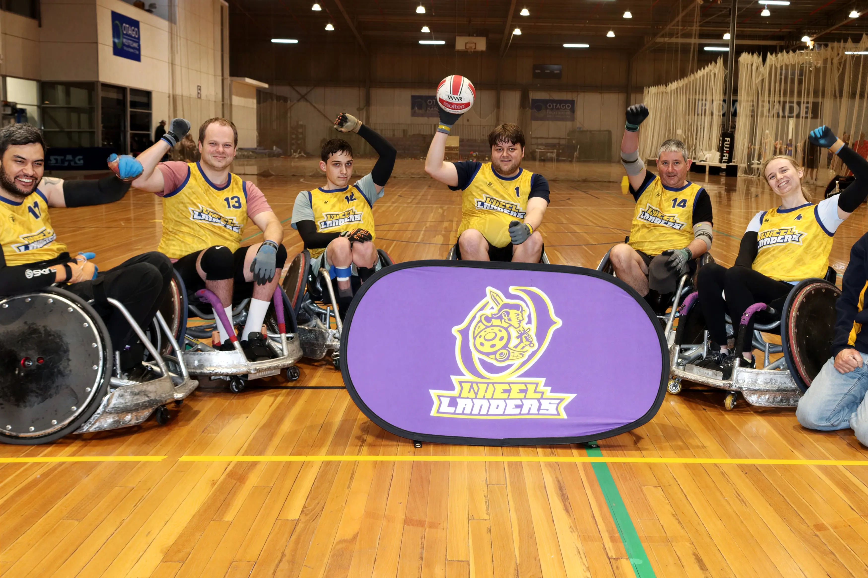 Ready to welcome wheelchair rugby teams from around the country are Otago WheelLanders (from left) Levi Mihaka, Scott Greaves, Matt Russell, 15, Nick Robertson, Morris McLeod, Libby McDonald and team mechanic Colin Russell. Photo: Sam Henderson