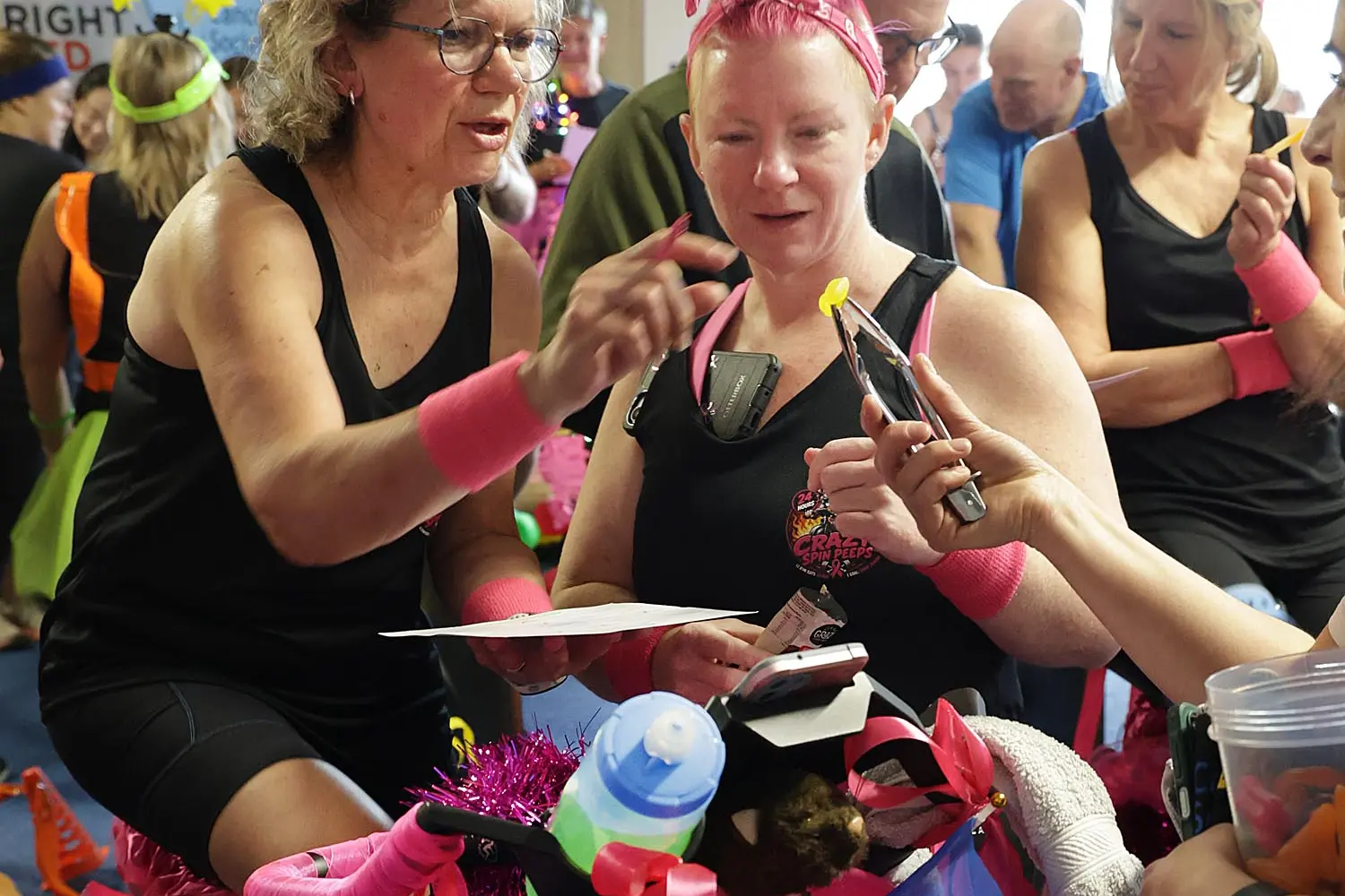 An energy sweet . . .Viv Cumming (left) and Sue Clifton  from the Crazy Spin Peeps team, take their turns on the bike hours after the start of the 24 hour long Big Spin at the MainPower Stadium over the weekend. Photo: John Cosgrove 