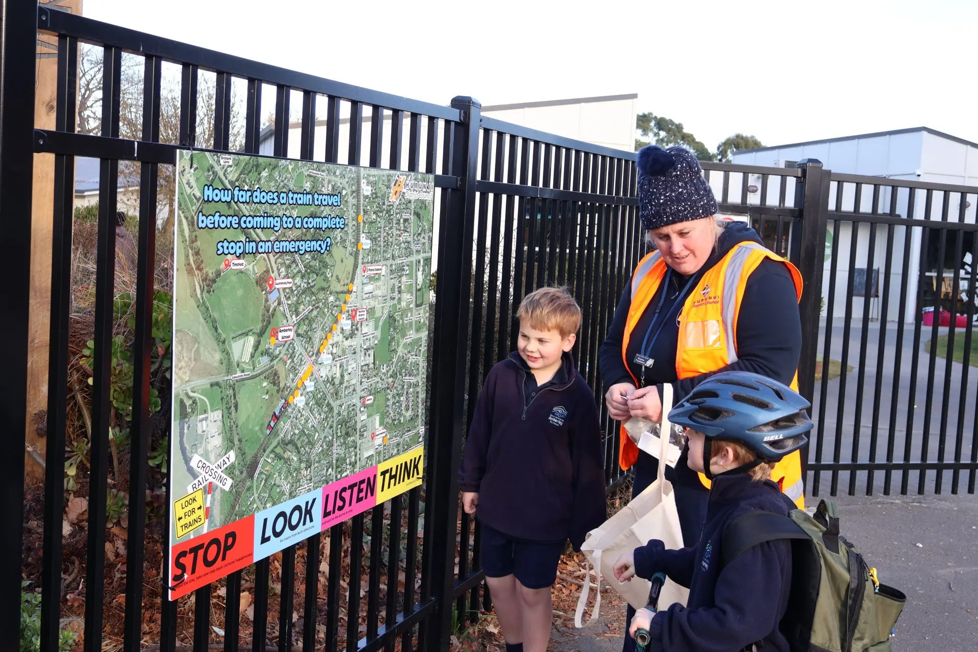 Rail safety . . . Huurnui District Council Safer Roads co-ordinator Emma Feathery explains ti Amberley School pupils, the distance a train needs to stop as part of Rail Safety Week. Photo: Supplied