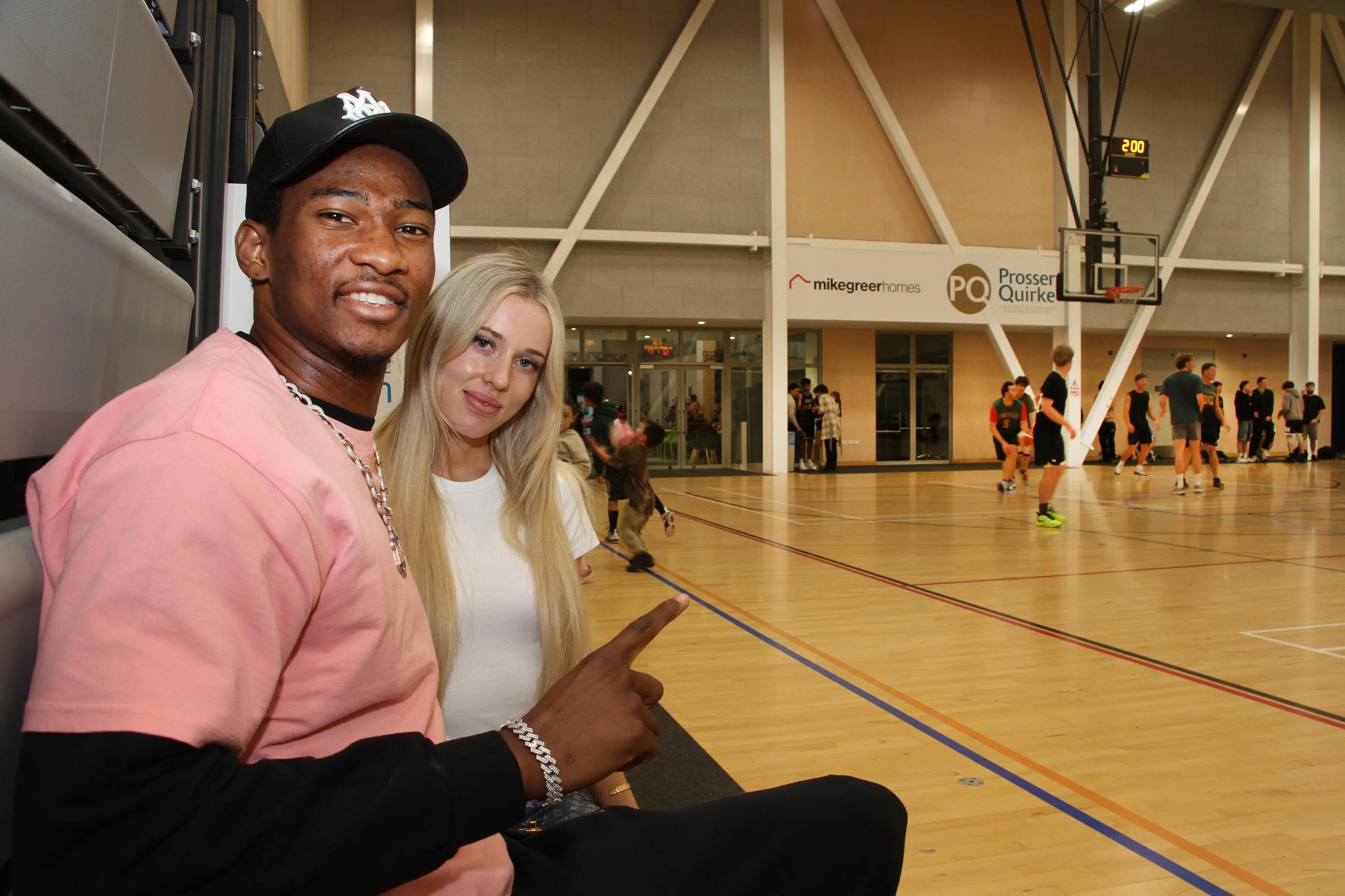 Enjoy a game . . . Newly weds Kai and Freya Jones watch a basketball game at the Rangiora Mainpower Stadium. Photo: John Cosgrove