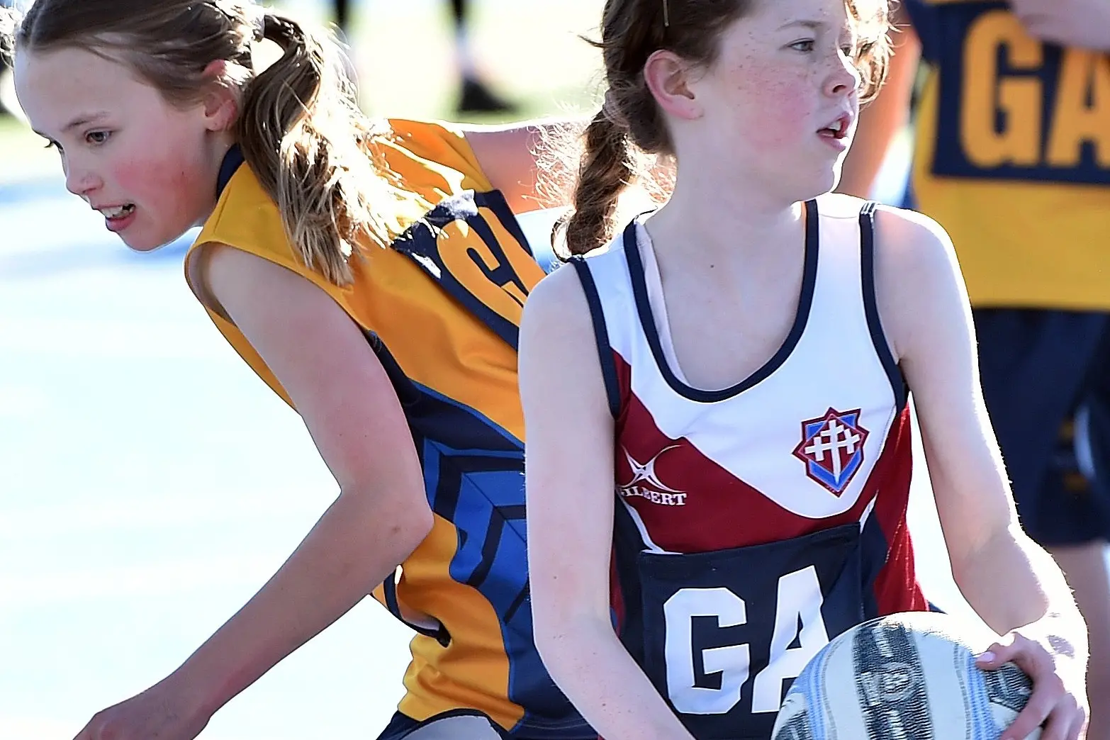 Taieri College pupil Maddie Guston, 11, defends Trinity Catholic College pupil Stella Boereboom, 11, in a netball match as part of the annual sport interchange event. Photo: Peter McIntosh