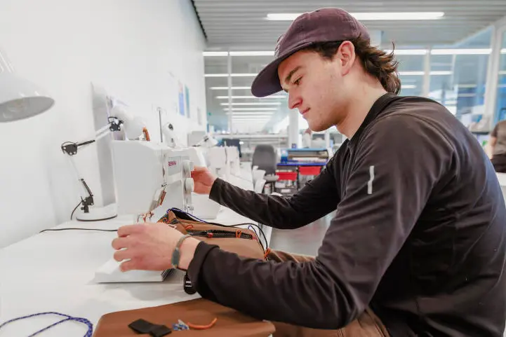 Jack Kerr on one of the sewing machines in the central library, T\\u016Branga. Photo: CCC