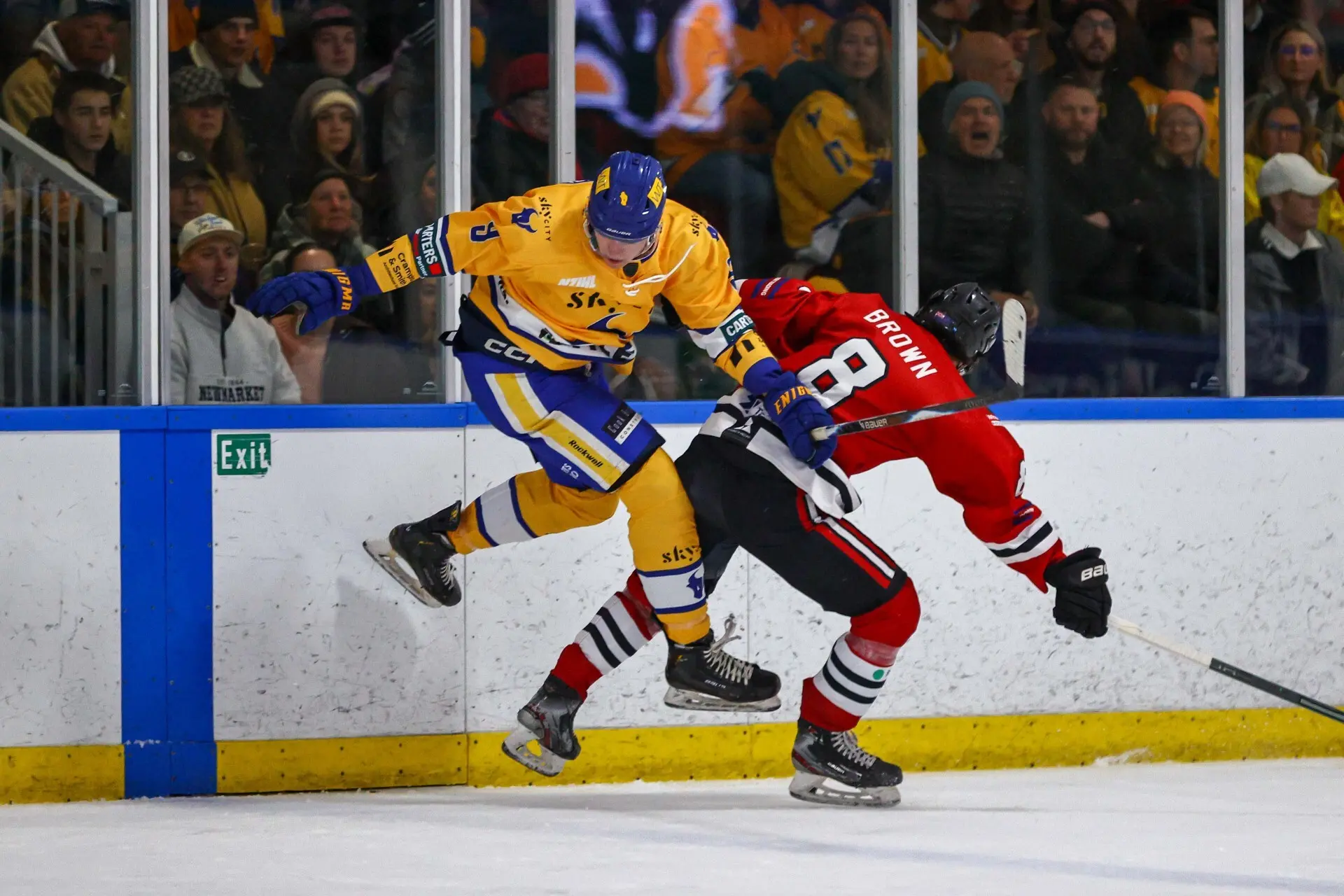 Air time: SkyCity Stampede\\'s Axel Ruski-Jones is hit by Canterbury Red Devils\\' Shaun Brown during their first semifinal encounter at the Queenstown Ice Arena on Friday night. Photo: James Allan Photography