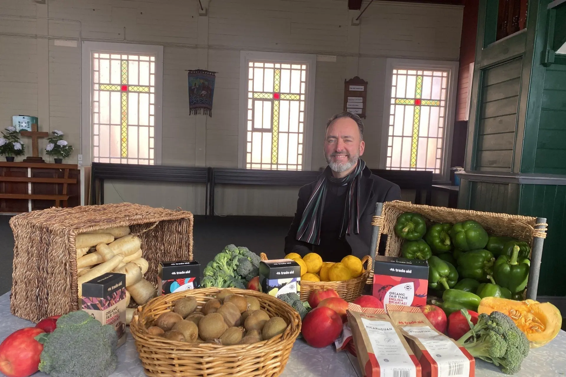 All Saints\\' Church Vicar Canon Dr Michael Wallace is pleased the All Saints\\' Fruit & Veges scheme will offer a small selection of Fair Trade goods each week from now on. Photo: Brenda Harwood