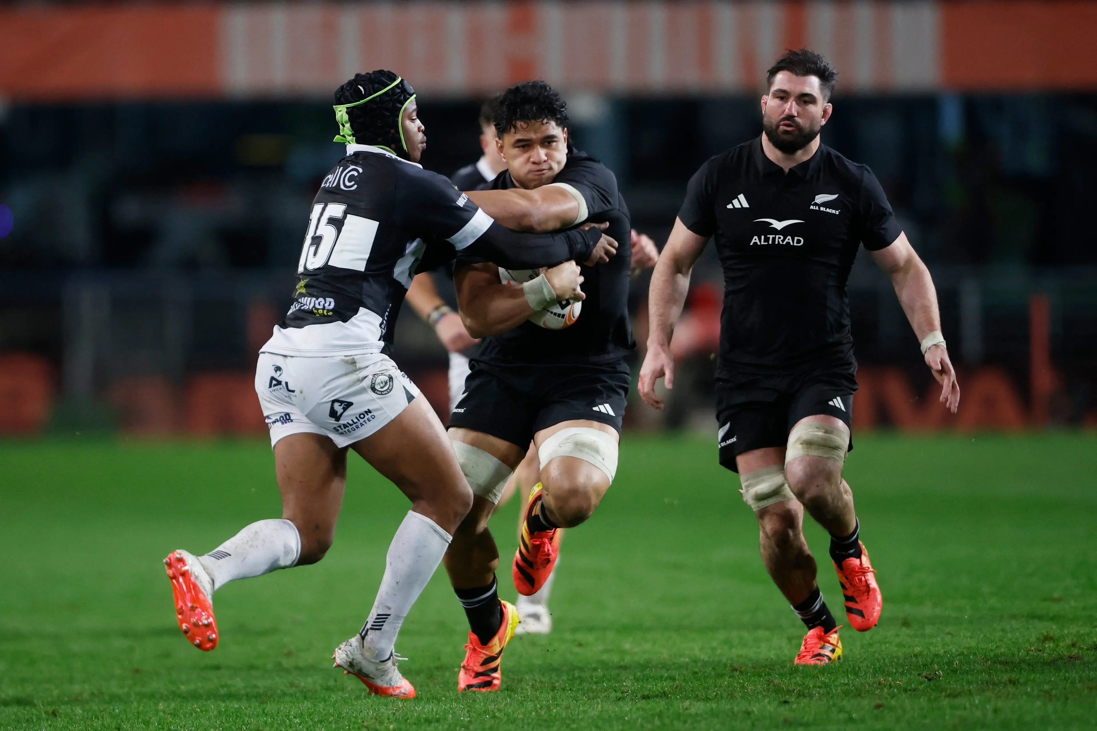 <p>Quinn Tupaea fends off&nbsp;Zekhethelo Siyaya during the All Blacks' thumping win over the Sharks in Durban. Photo: Reuters&nbsp;</p>\\n