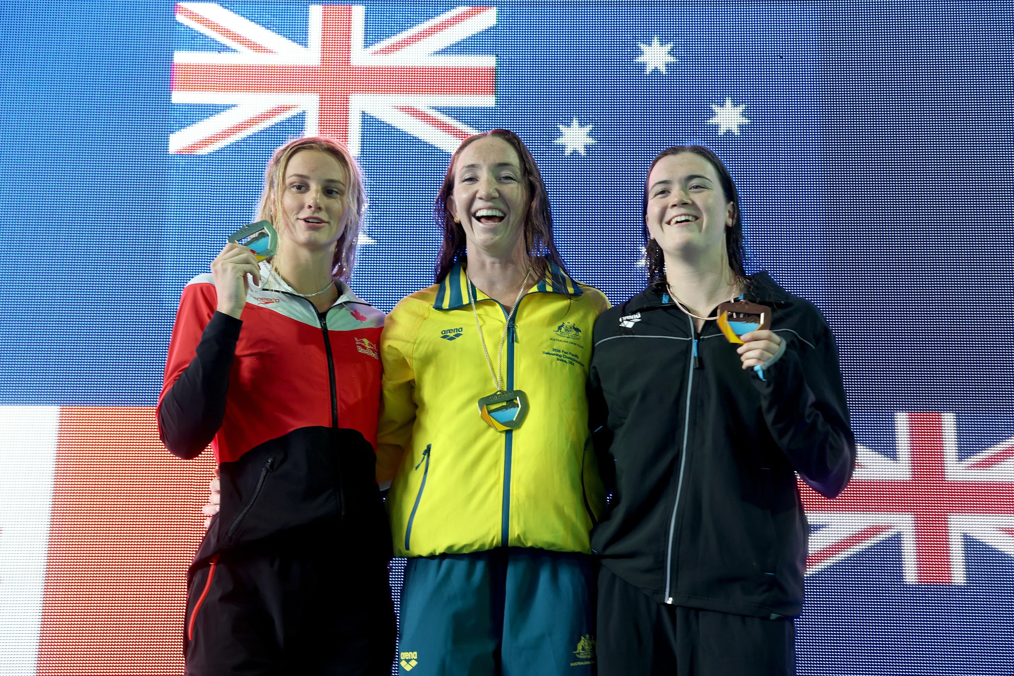 Summer McIntosh (Canada, silver), Lani Pallister (Australia, gold) and New Zealand\\u2019s Erika Fairweather (bronze) on the podium for the Women\\'s 200m Freestyle on Day 1 of the Pan Pacific Swimming Championships at William Woollett, Jr. Aquatics Center in Irvine, California on Thursday. Photo: Getty Images