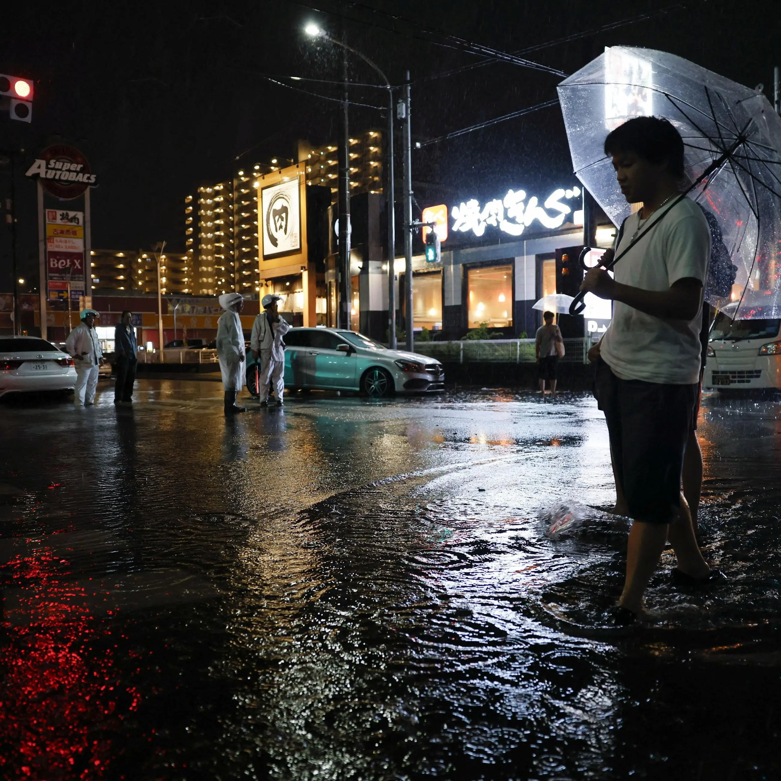 Thousands stranded at airport as record rain falls in Tokyo
