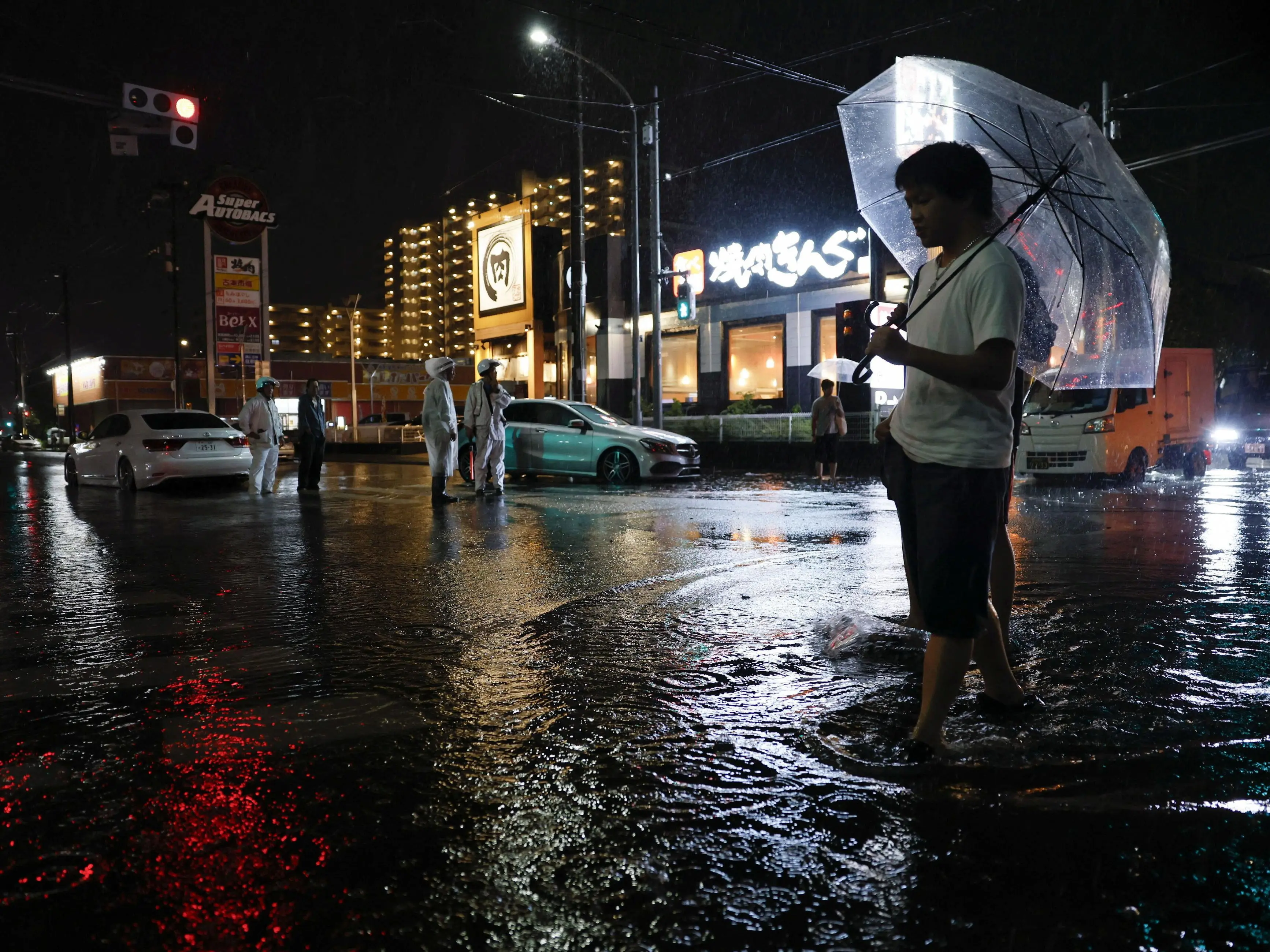 Thousands stranded at airport as record rain falls in Tokyo